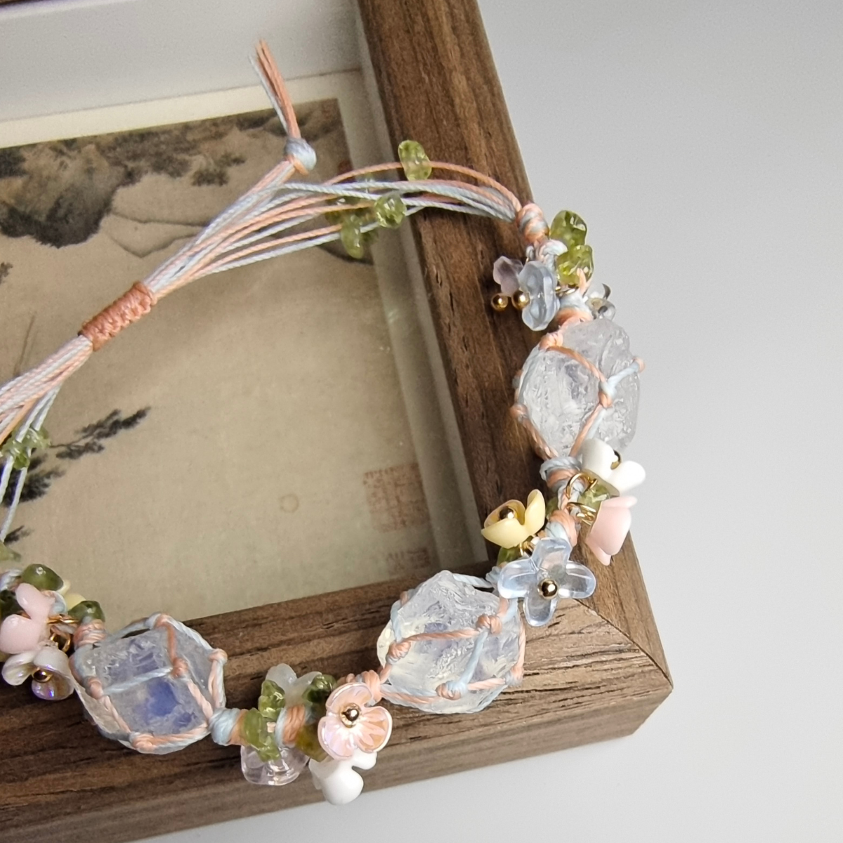 Detailed view of opal bracelet with wire wrapping