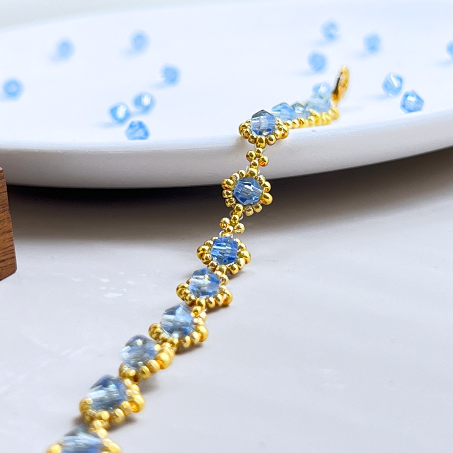 Detailed view of handmade bracelet with sky blue beads