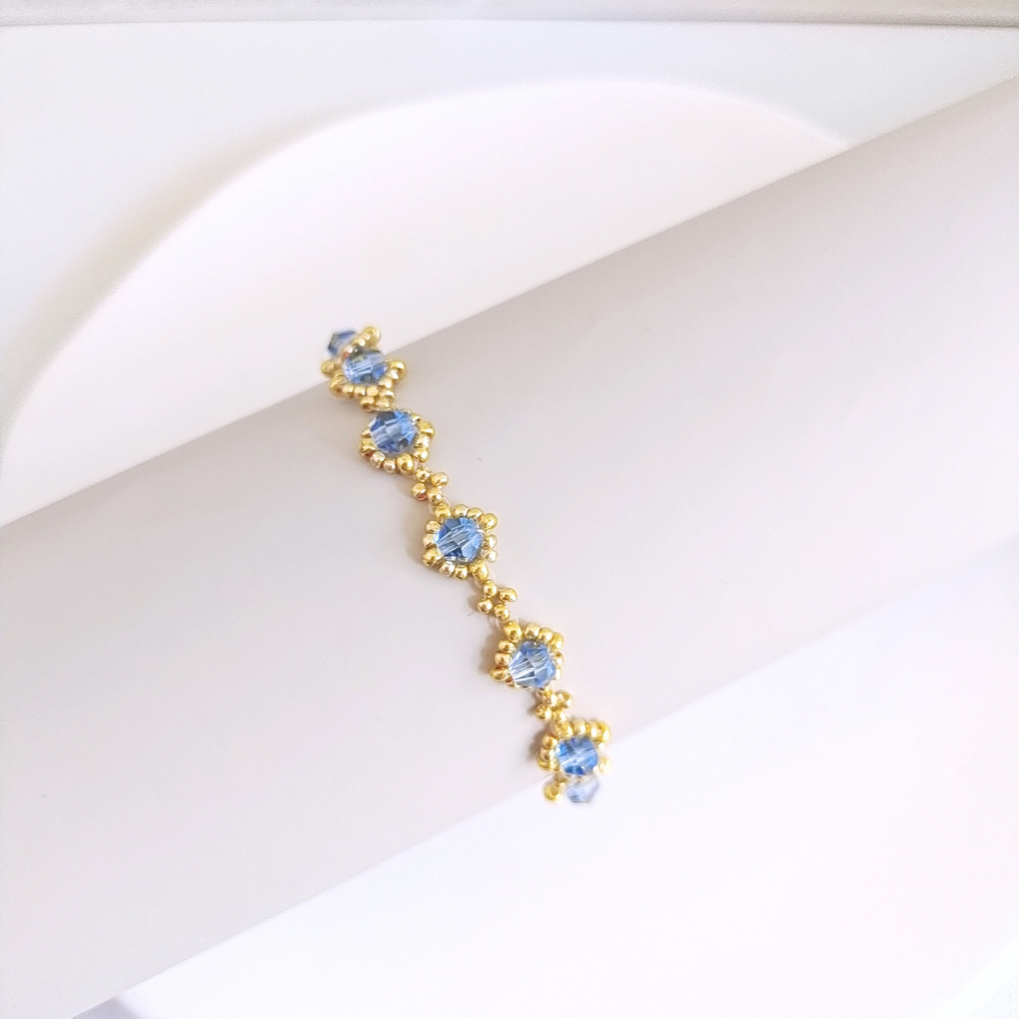 Full view of sky blue beaded bracelet