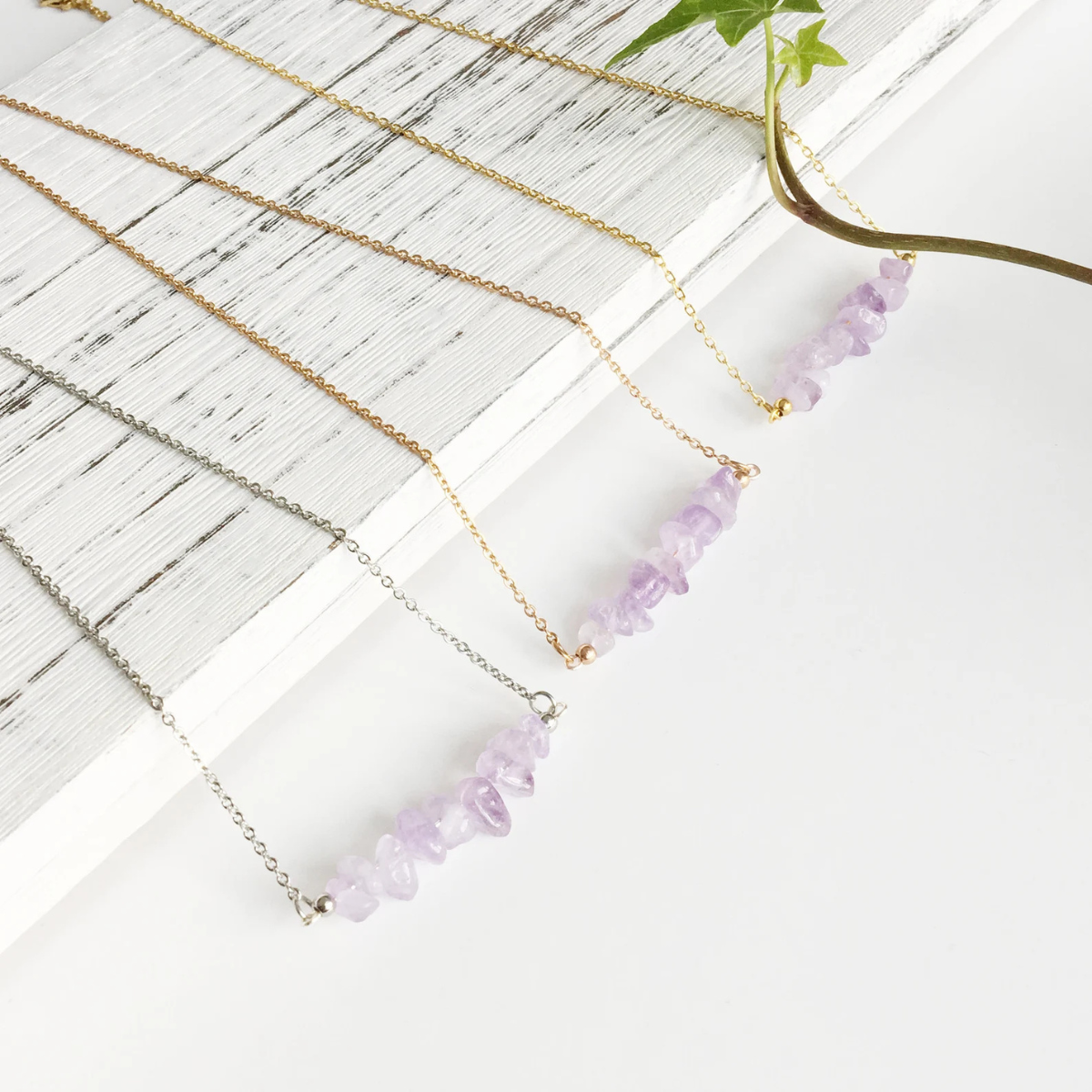 Detailed view of raw amethyst chips in handcrafted necklace
