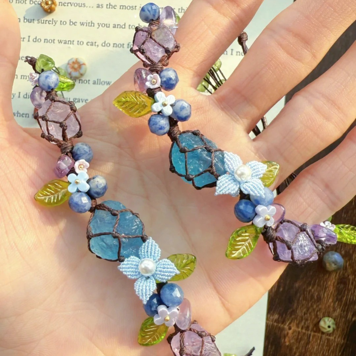 Close-up of aquamarine and amethyst raw stone bracelet