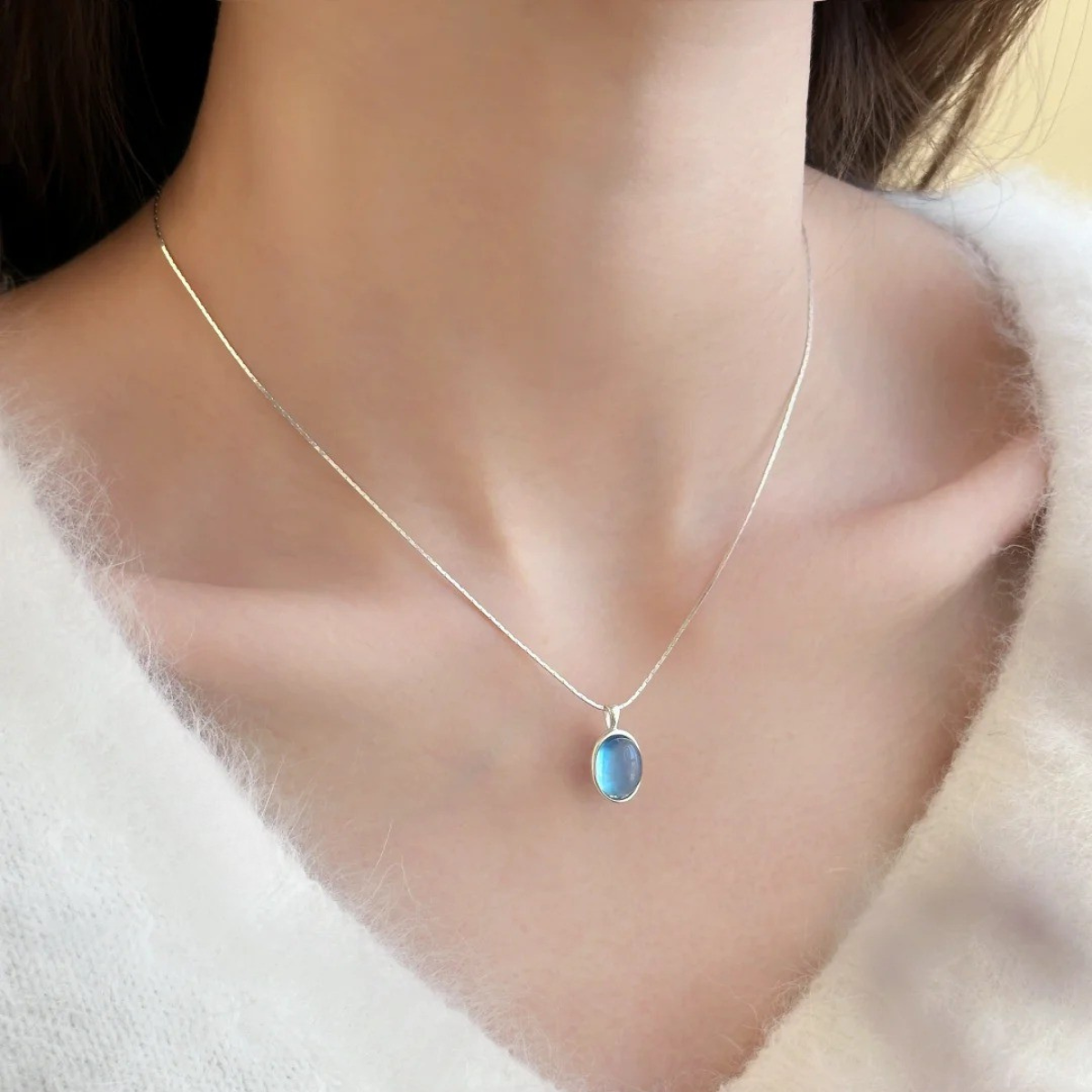 Wearing an aquamarine necklace