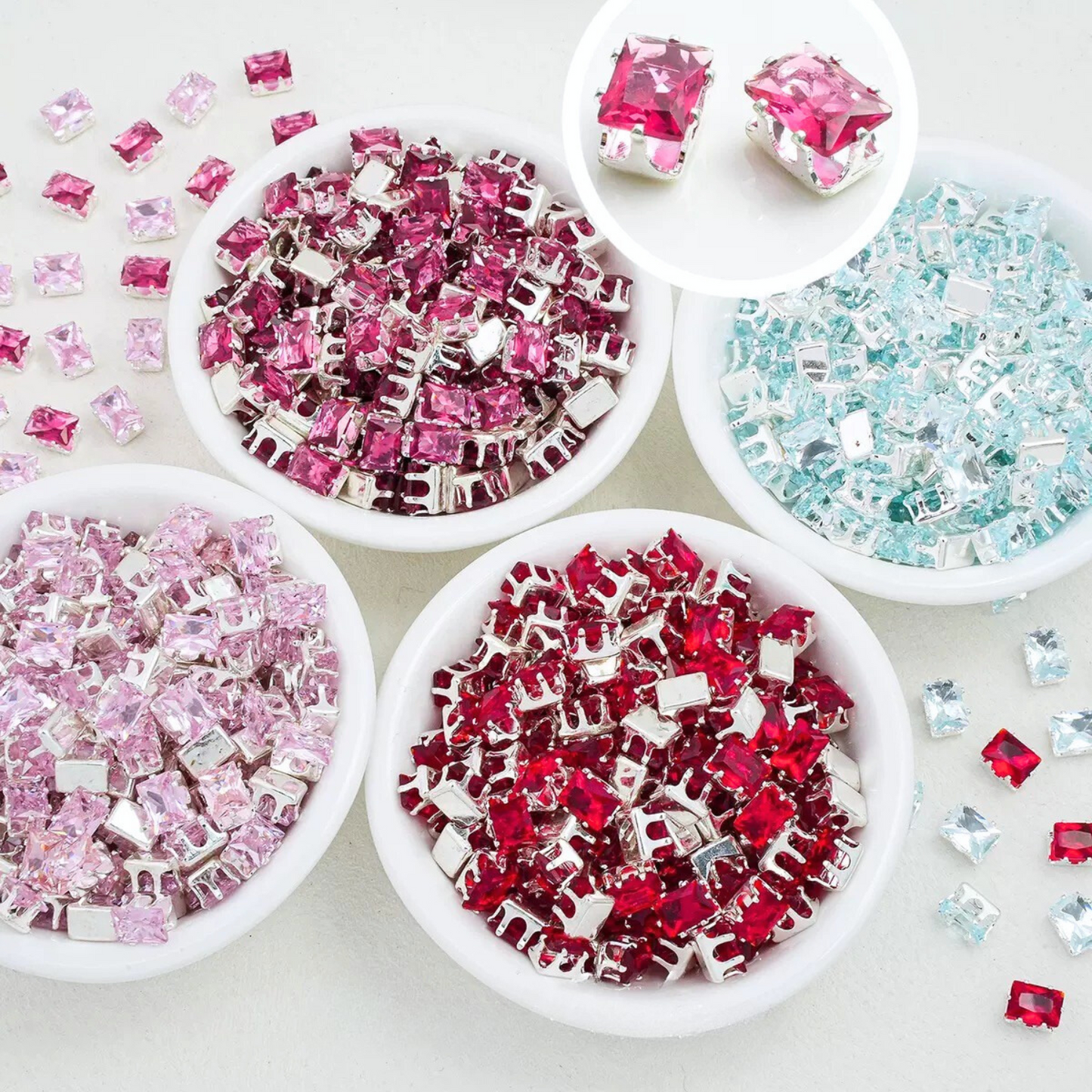 Emerald-cut CZ stones in silver prong mounts