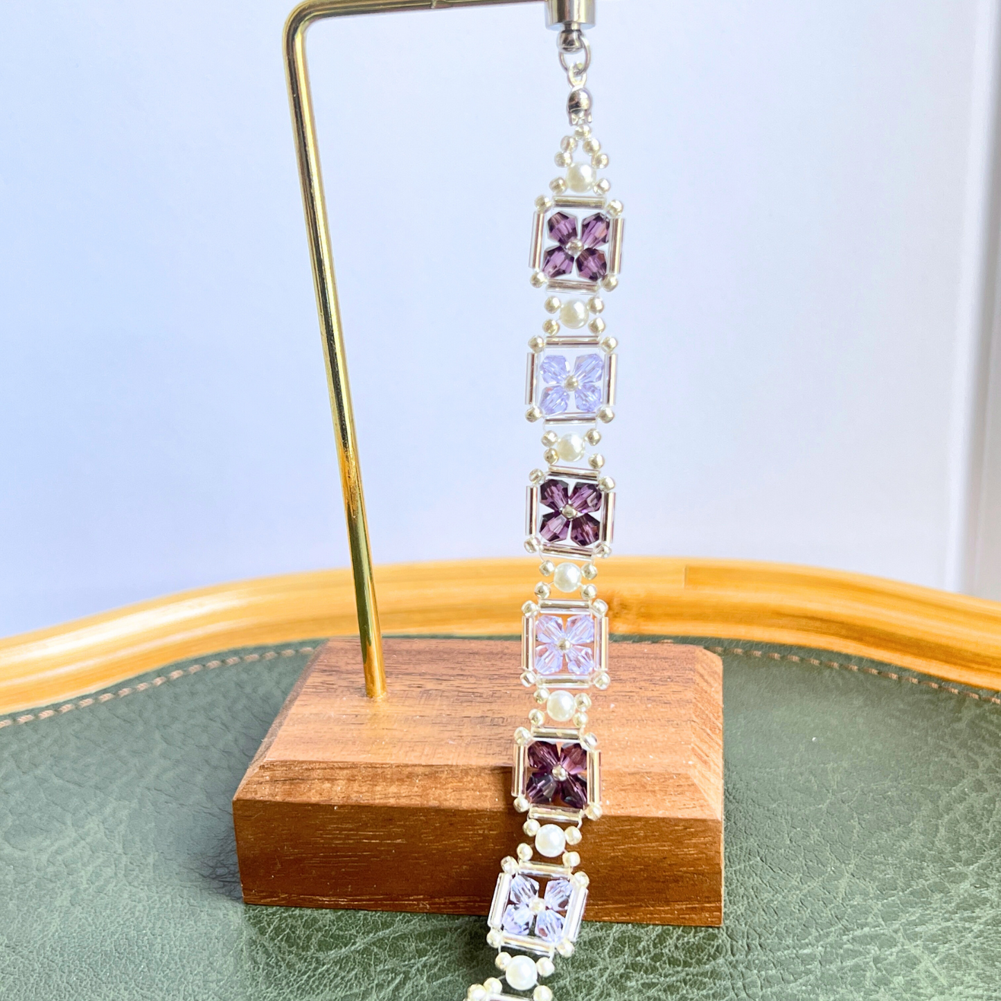 Close-up of handmade beaded bracelet with grape purple color