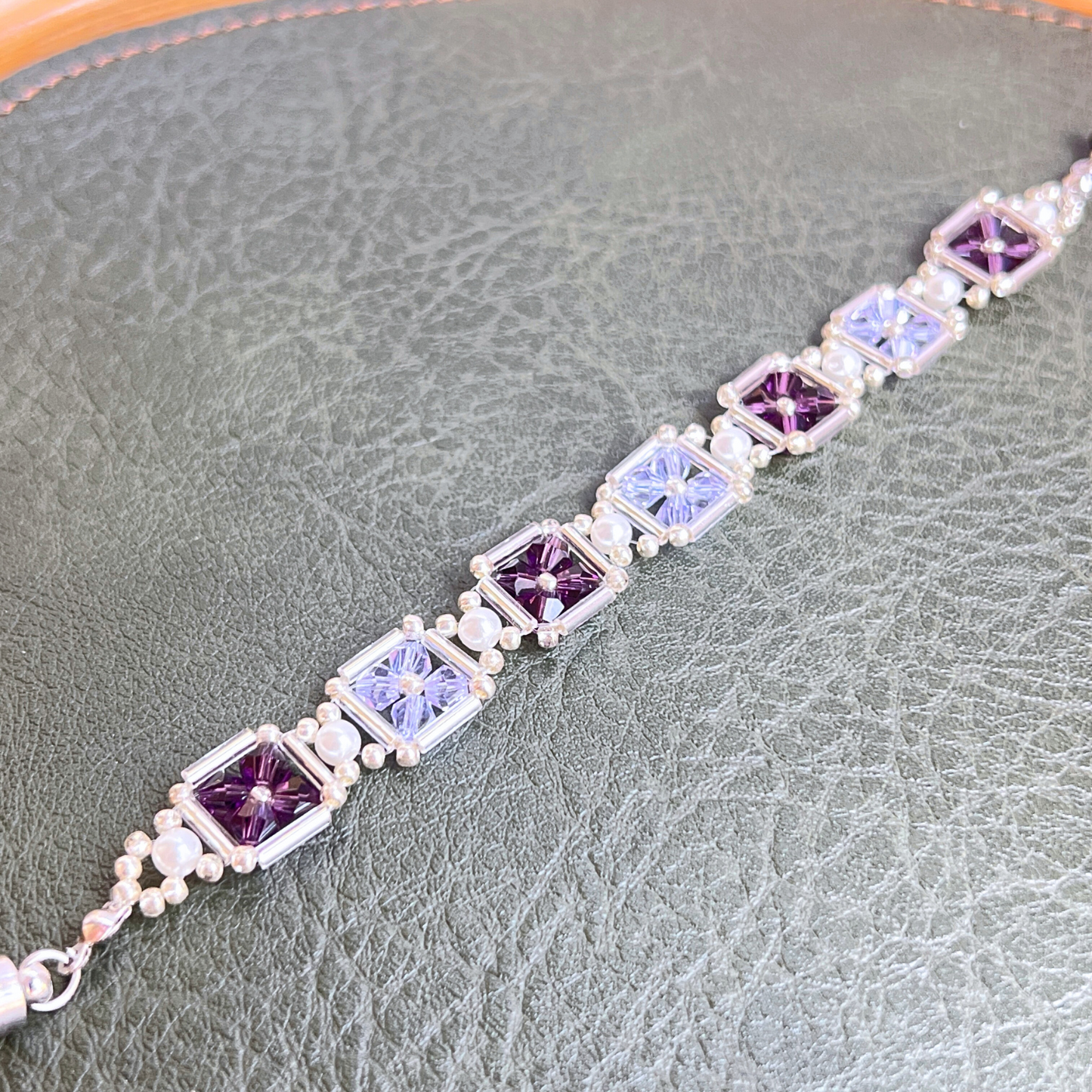 Detailed close-up of grape purple beaded bracelet