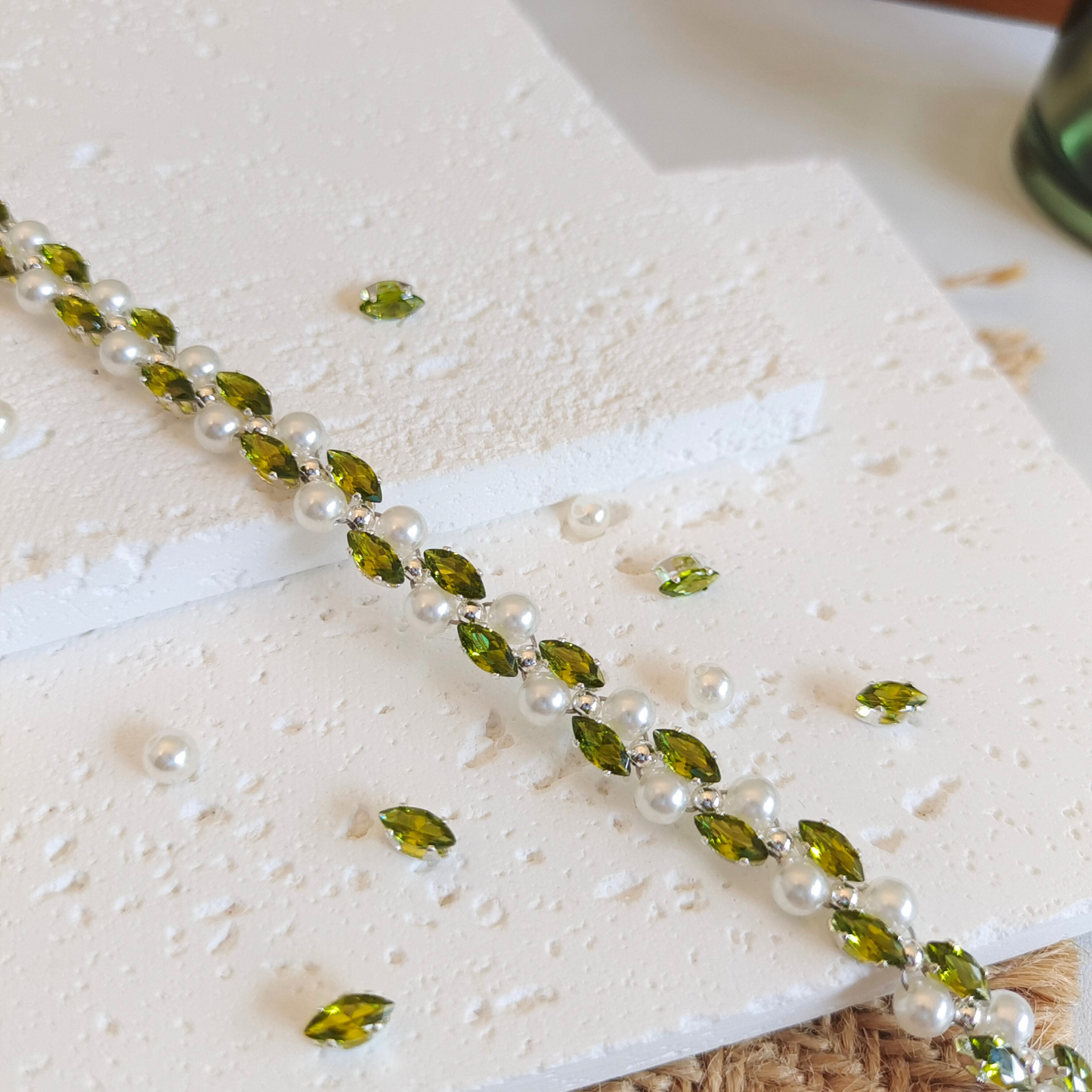 Olive green marquise zircon and pearl bracelet close-up shot