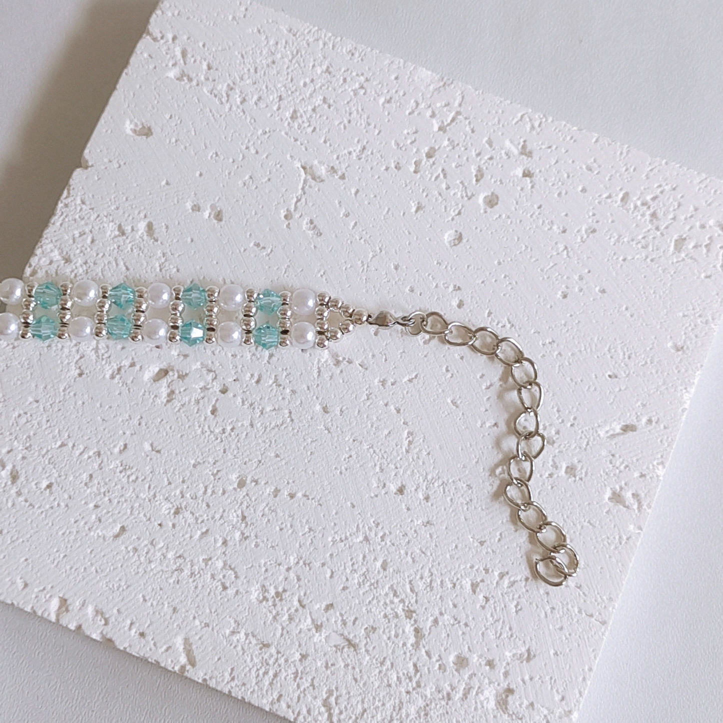 Detailed view of snow blue crystal diamond beads in handcrafted bracelet