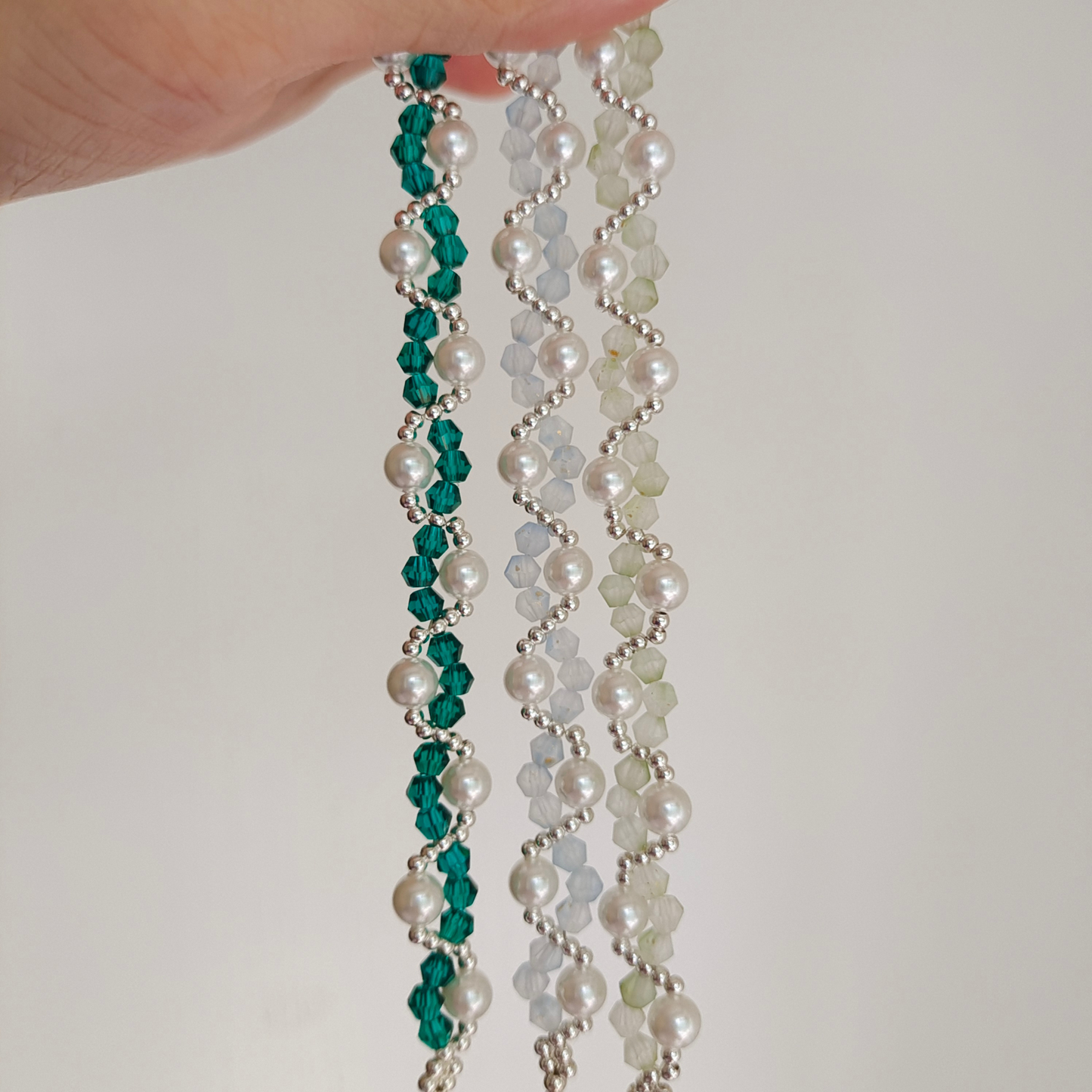 Curved beaded bracelet with cream-toned frosted crystals and statement pearls