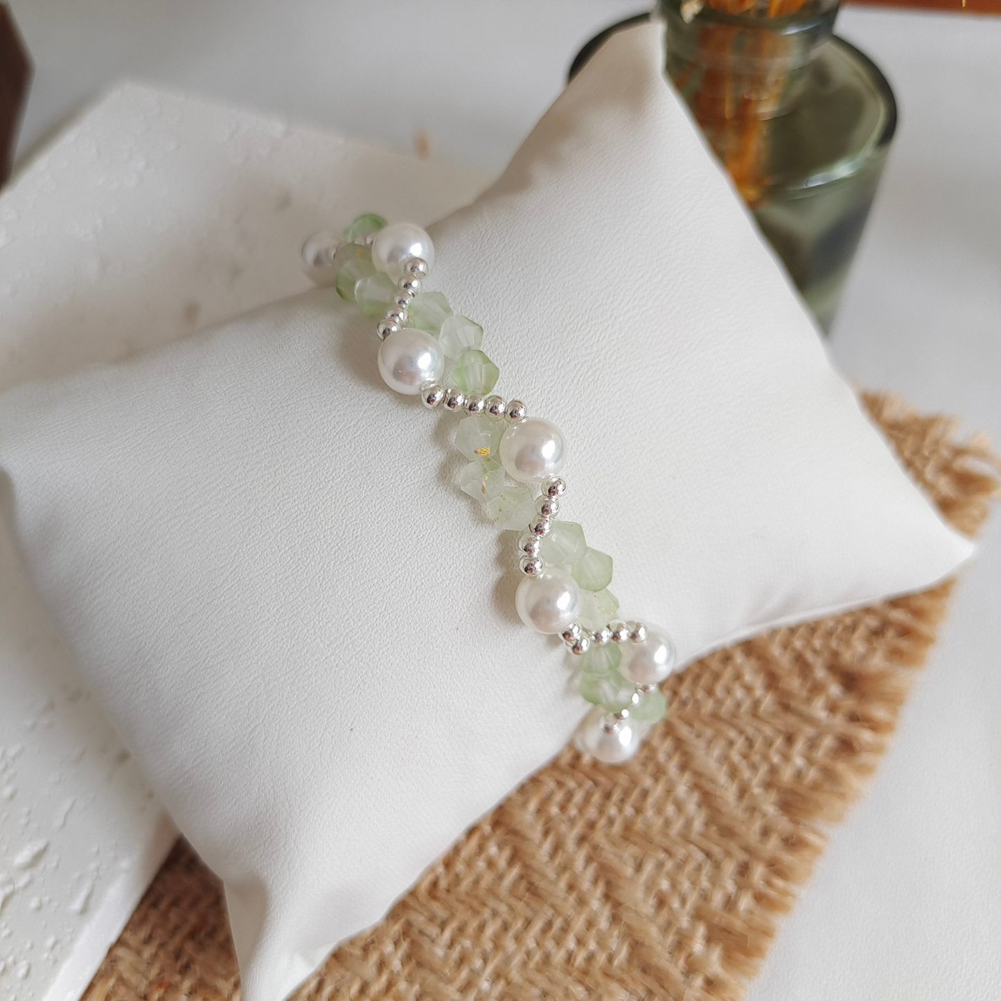Creamy green crystal and pearl beaded bracelet in elegant wave design