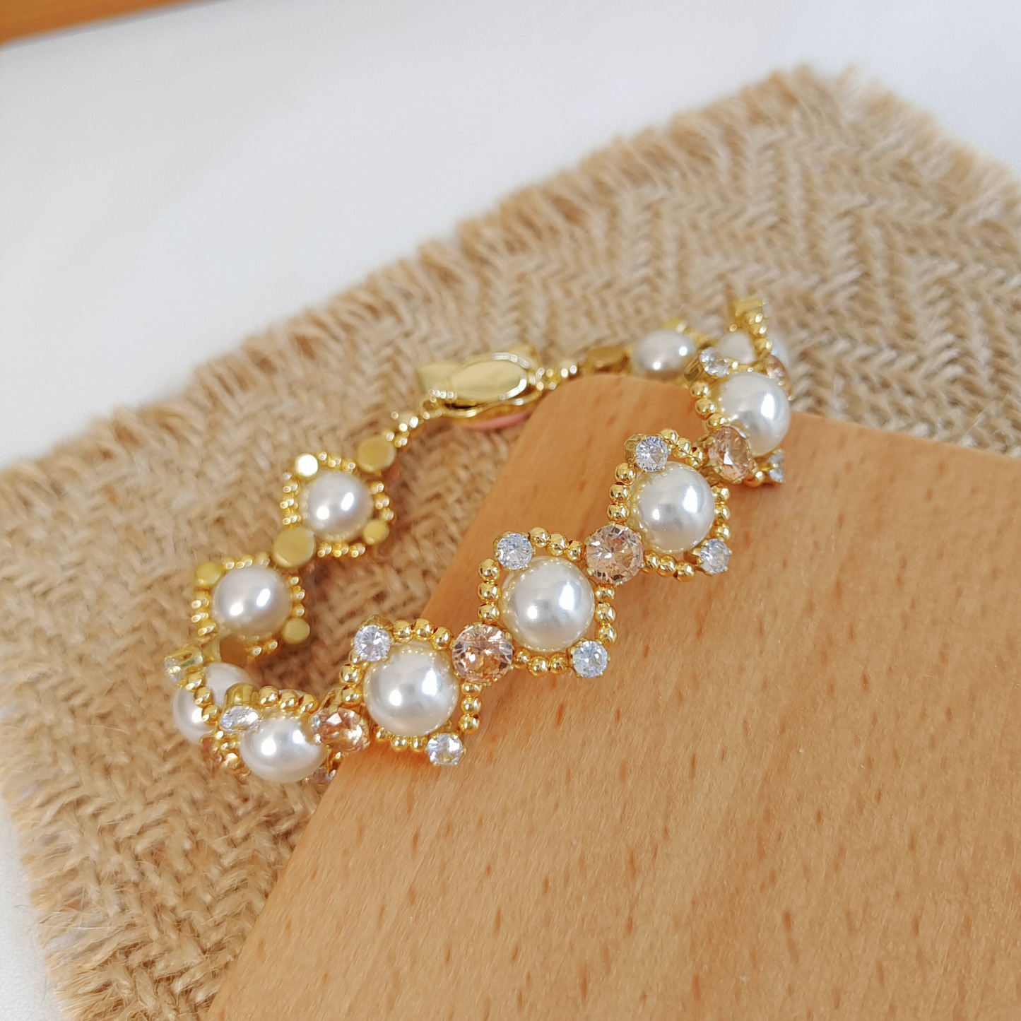 Delicate pearl bracelet featuring cute LinaBell character clasp