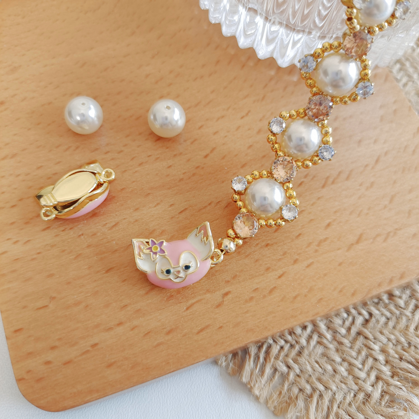 Close-up of LinaBell character clasp in gold-tone finish