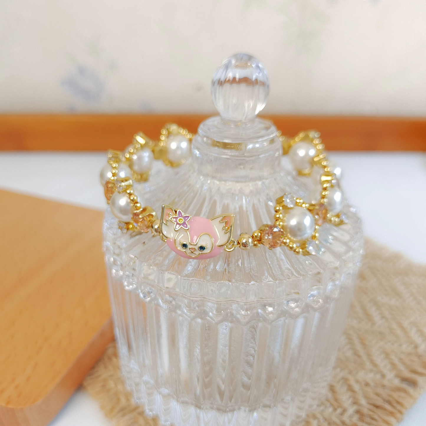 Delicate pearl bracelet featuring cute LinaBell character clasp