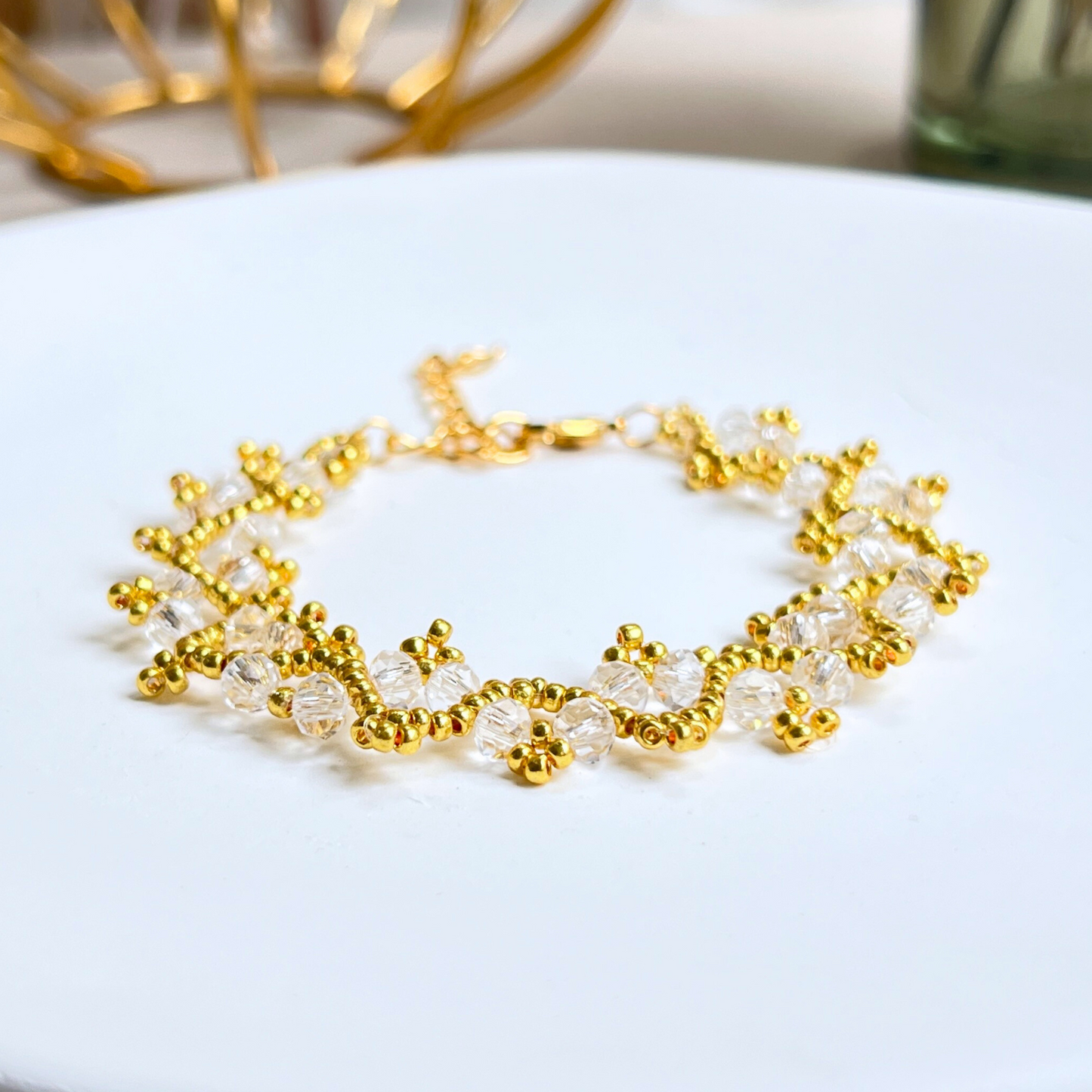 Detail shot of a handmade bracelet with clear wheel-shaped beads