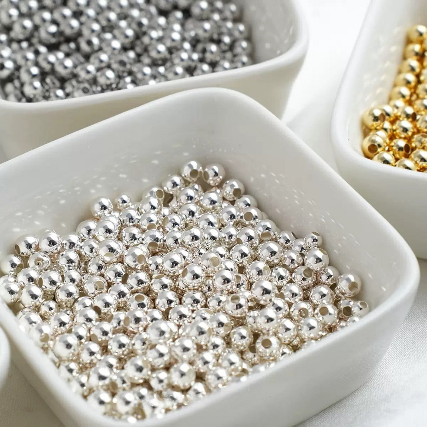 Tiny metallic silver beads perfect for DIY bracelet and necklace designs