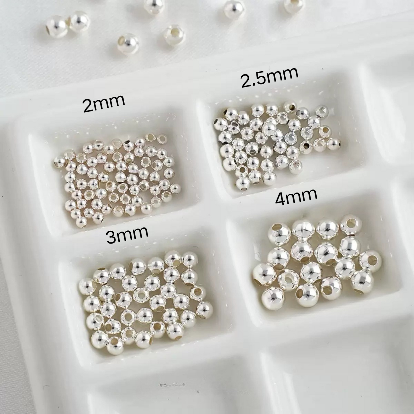 Silver seed beads in four different sizes for versatile jewelry making