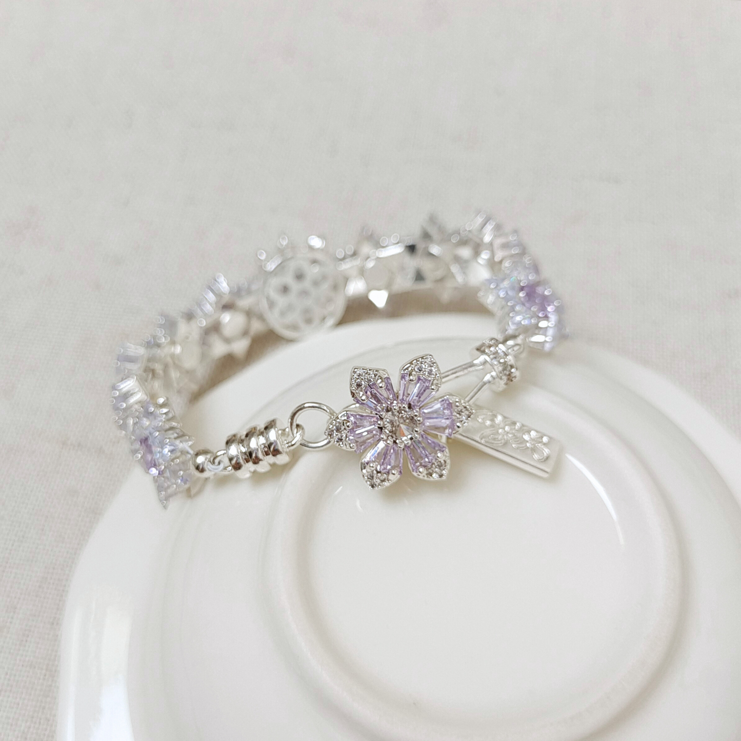 DIY clasp with purple stone in cherry blossom design – close-up