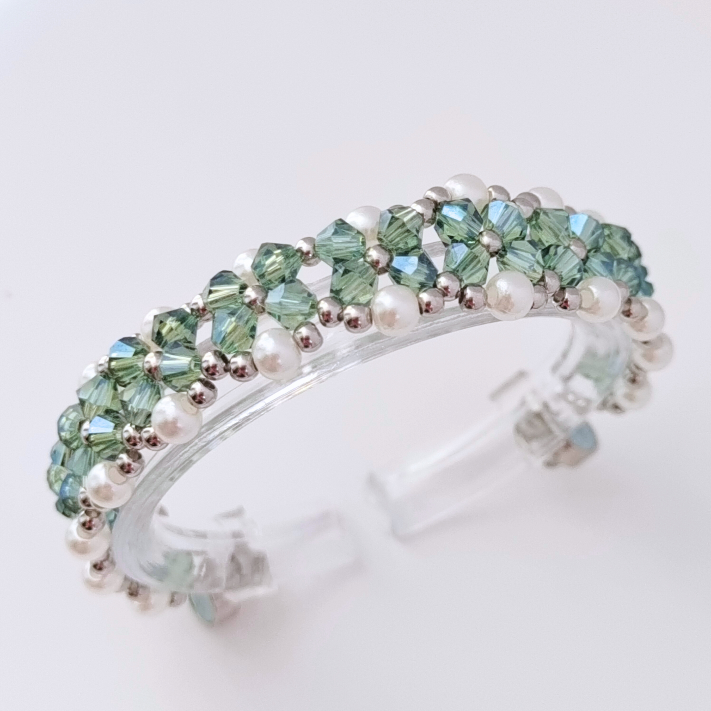 Close-up view of gray-green diamond beads bracelet