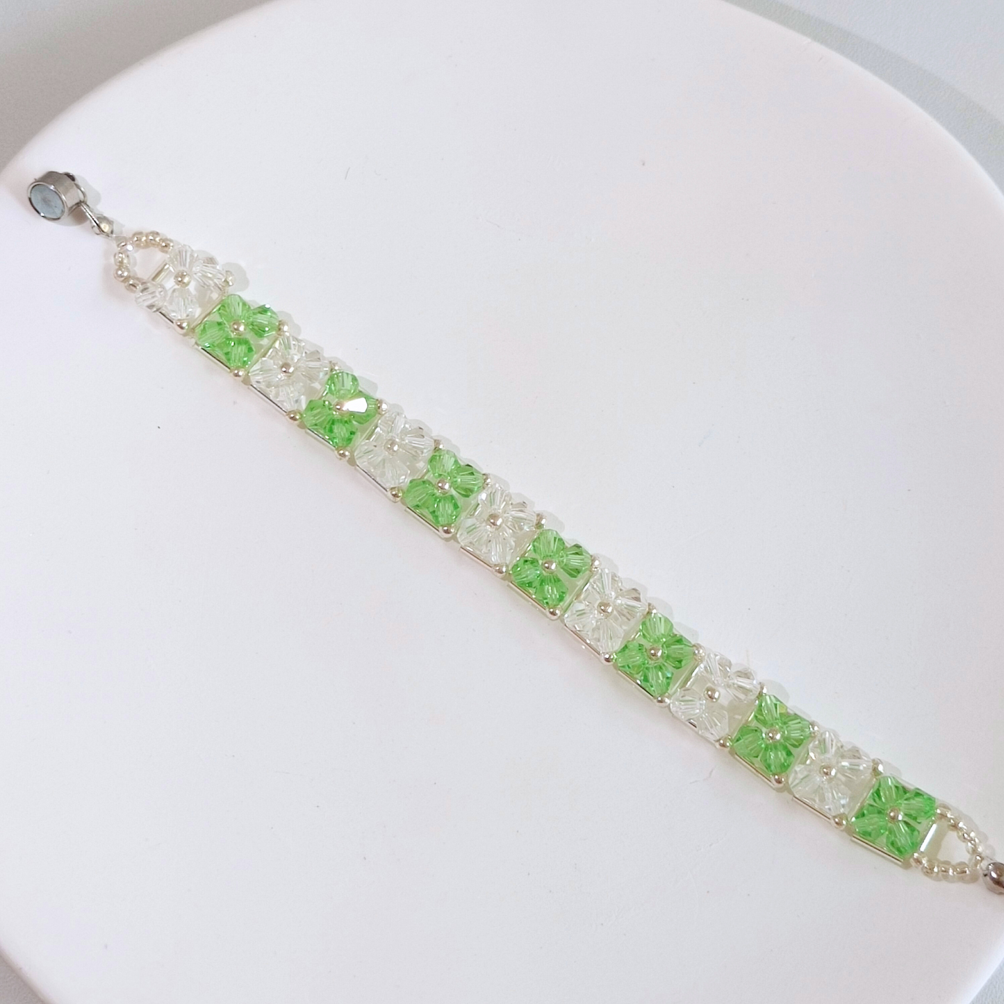 Full view of green and clear diamond bead bracelet