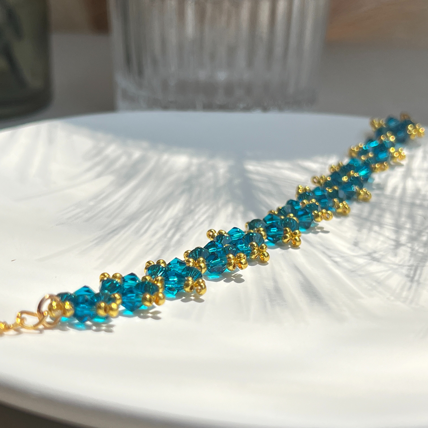 Detailed view of handmade bracelet with navy blue beads