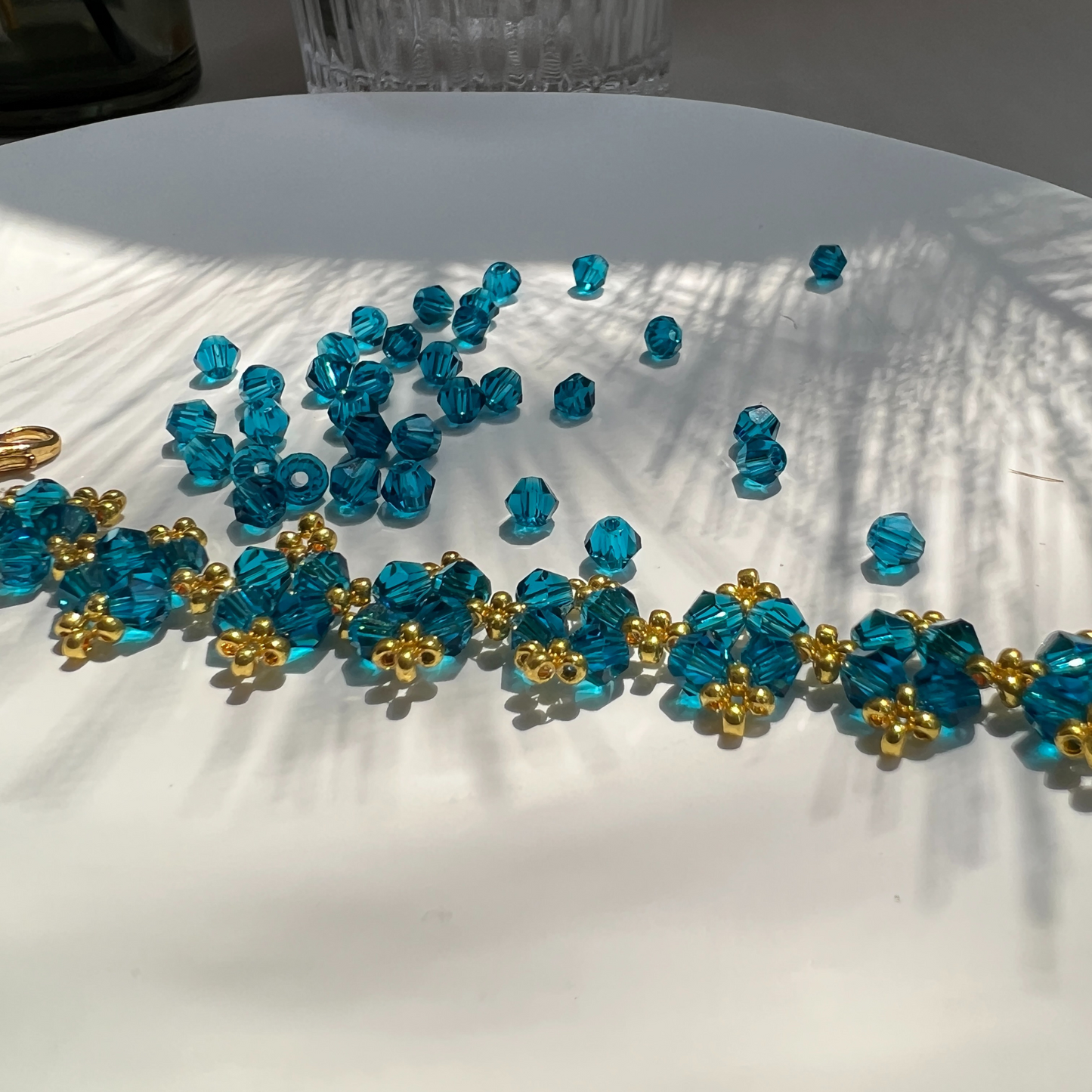Navy blue faceted diamond beads shown with a finished beaded bracelet
