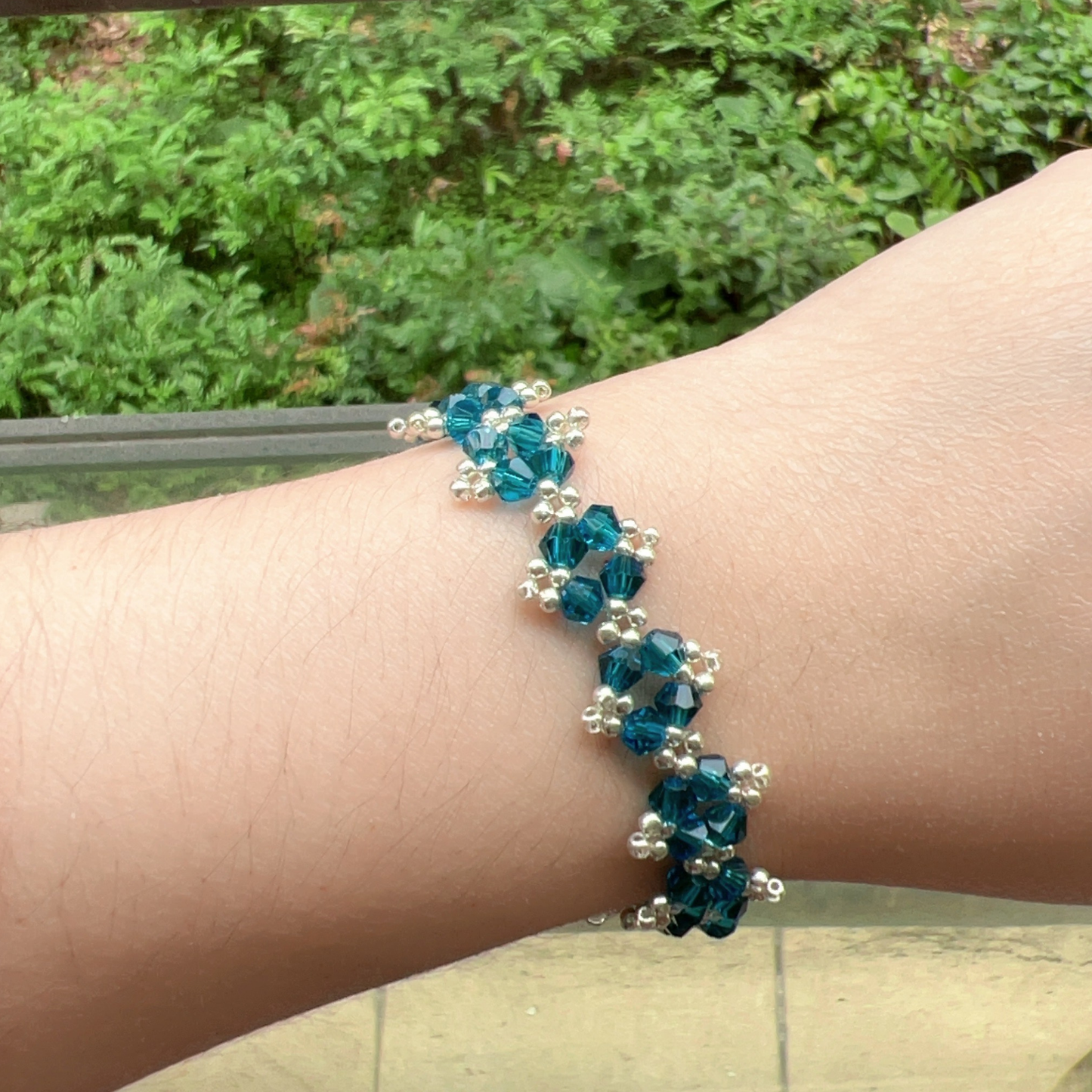 Wrist shot of navy blue beaded bracelet