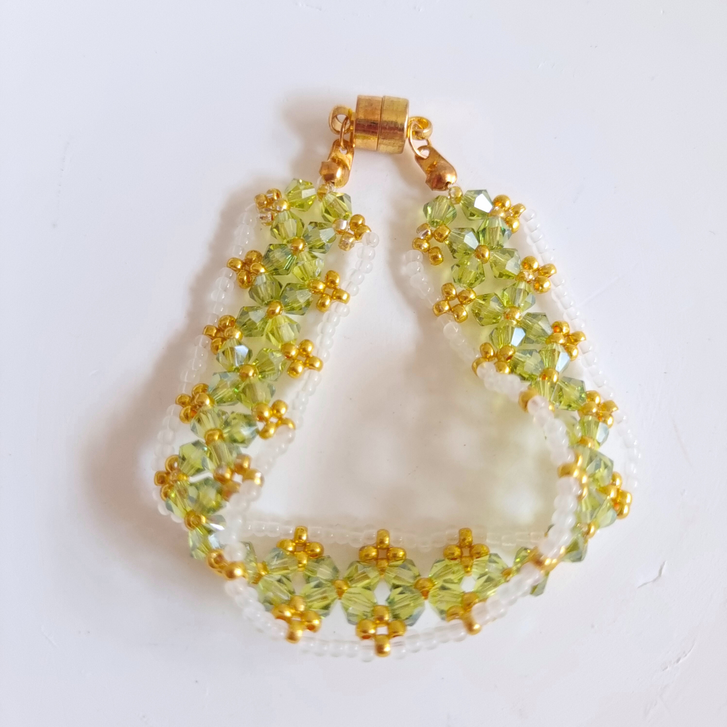 Close-up of olive green beaded bracelet