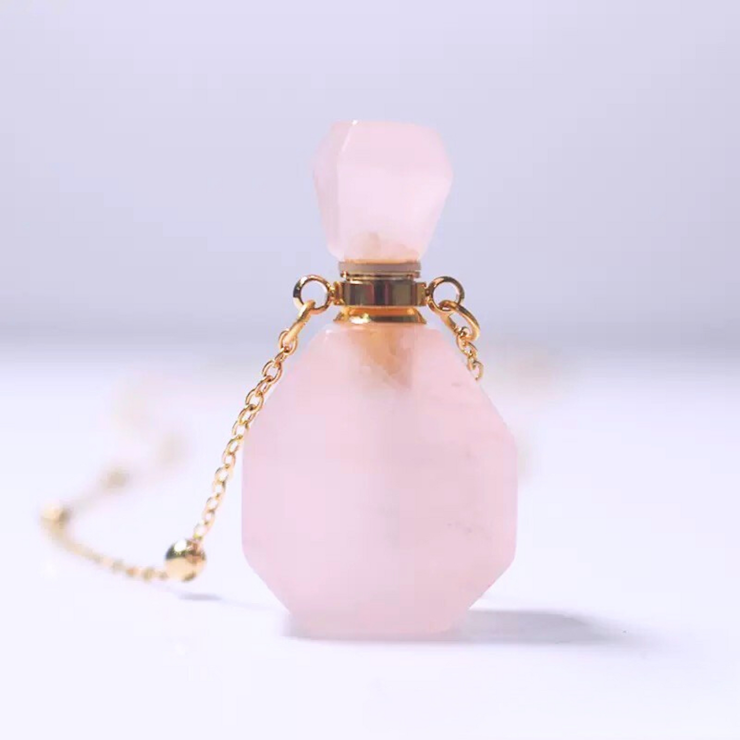 Front view of rose quartz perfume bottle pendant