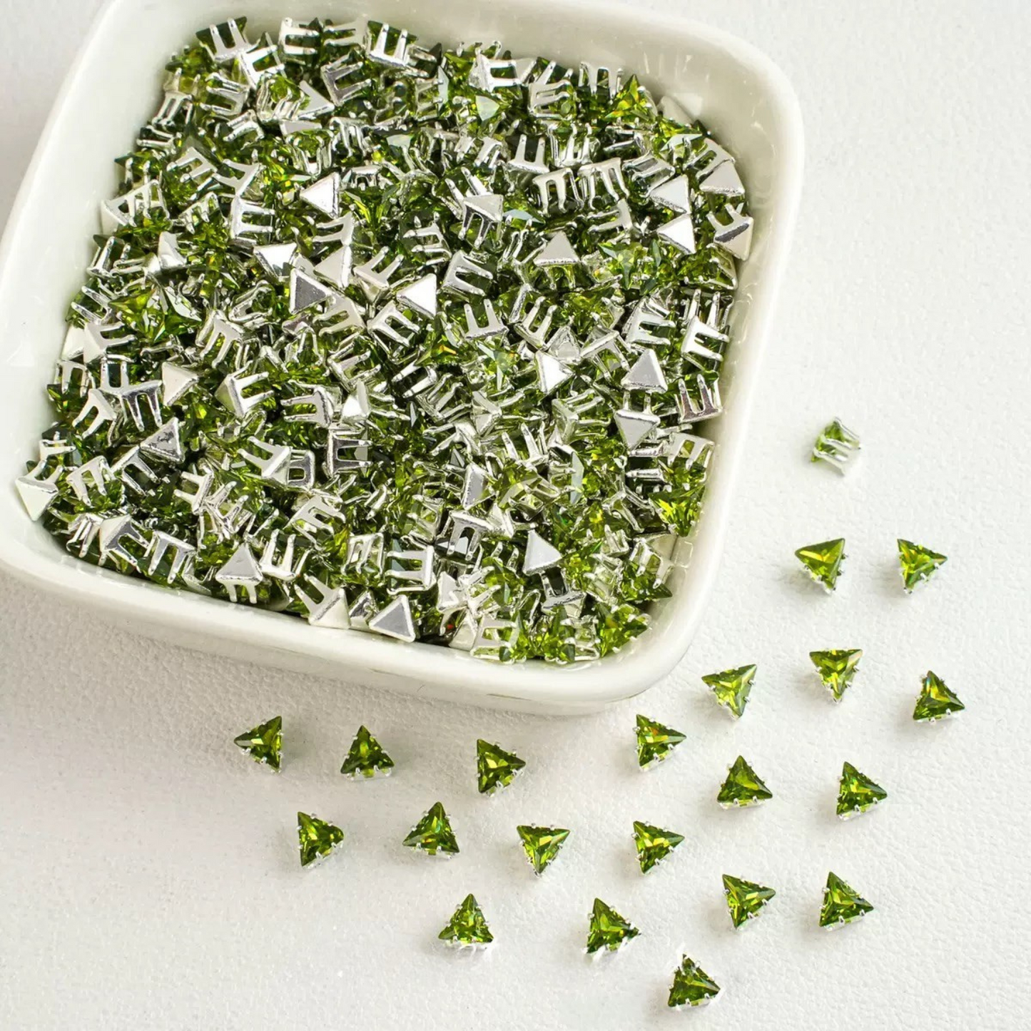 Olive green faceted triangle zirconia beads set on silver backing