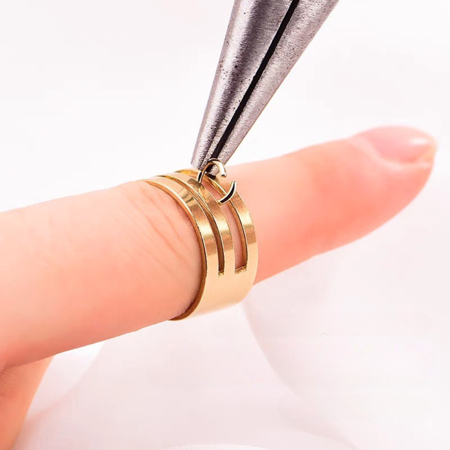 Jump ring opener in use