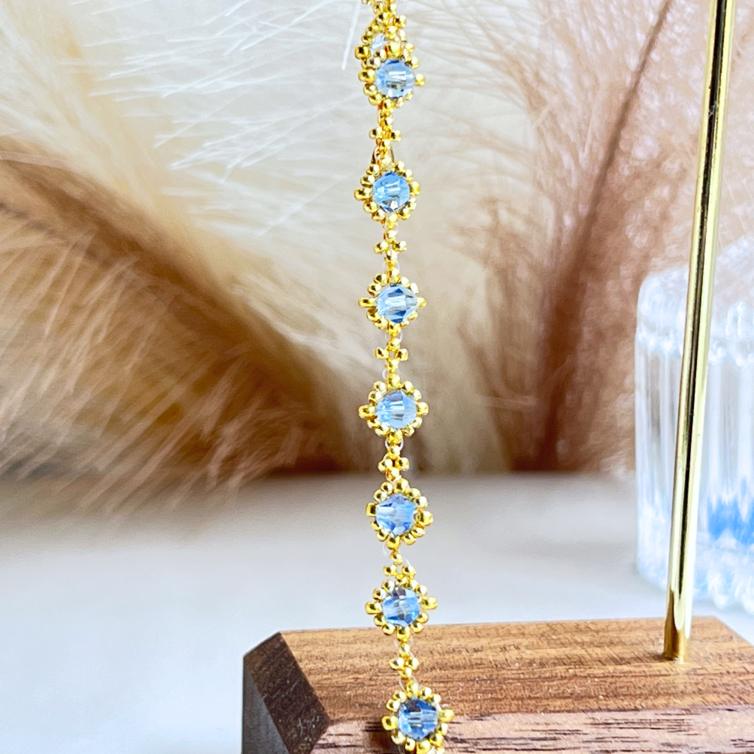 Detailed close-up of sky blue beaded bracelet 