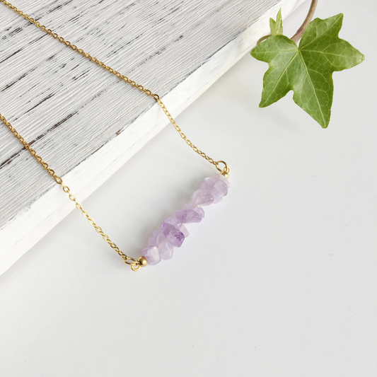 Close-up of raw amethyst chips in handcrafted necklace