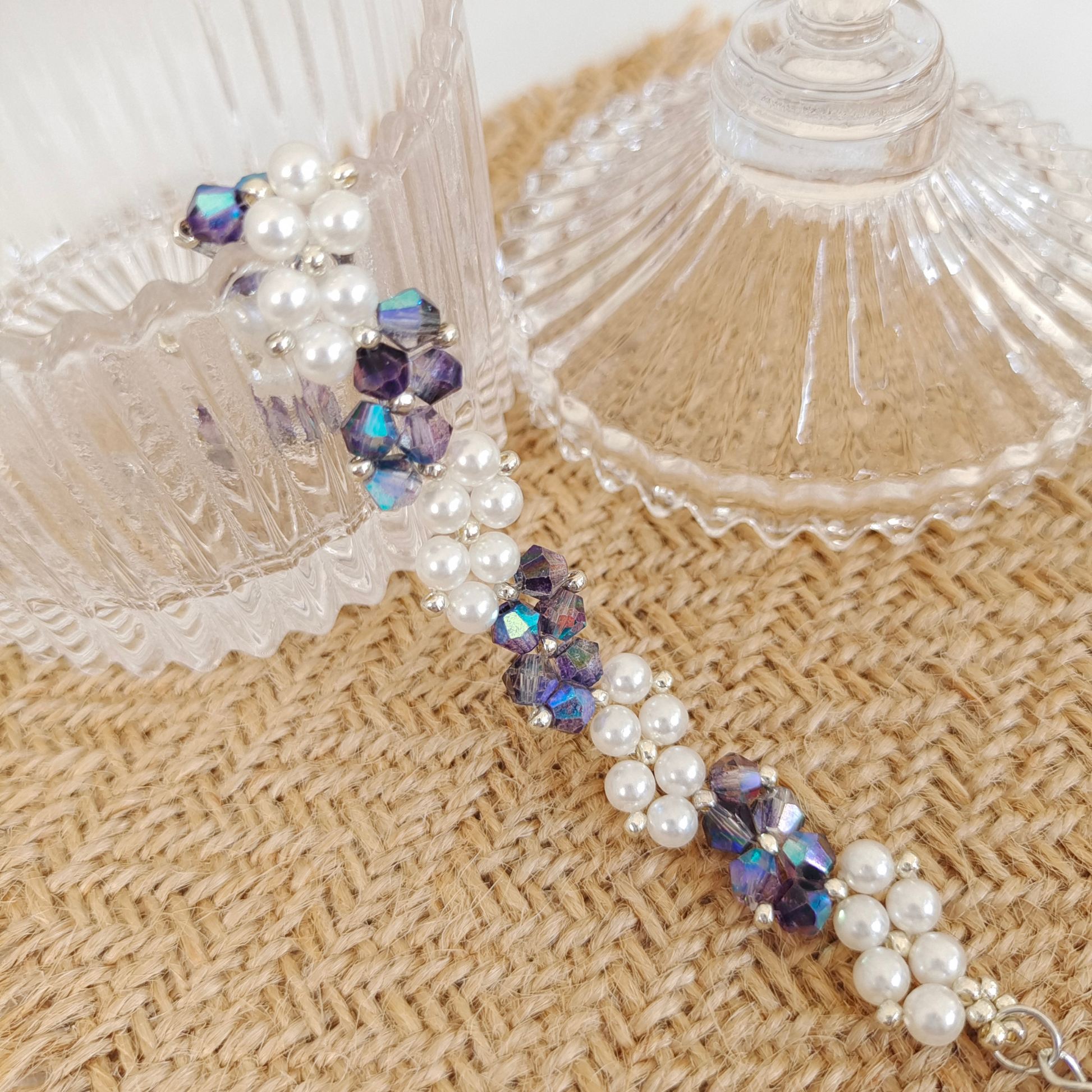 Detail of handmade bracelet with ink blue diamond beads and pearls