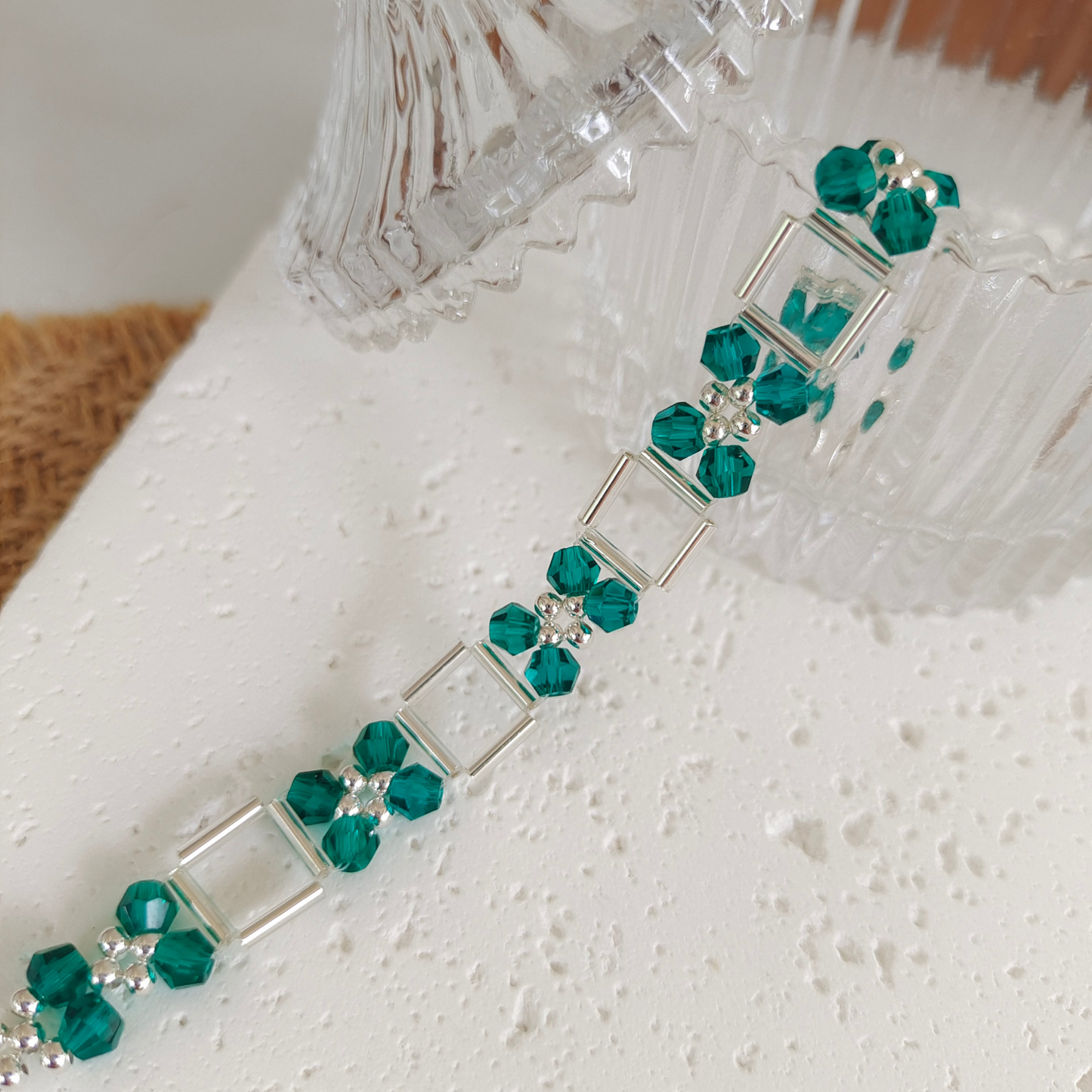 DIY bracelet detail view – peacock green crystal and silver beads
