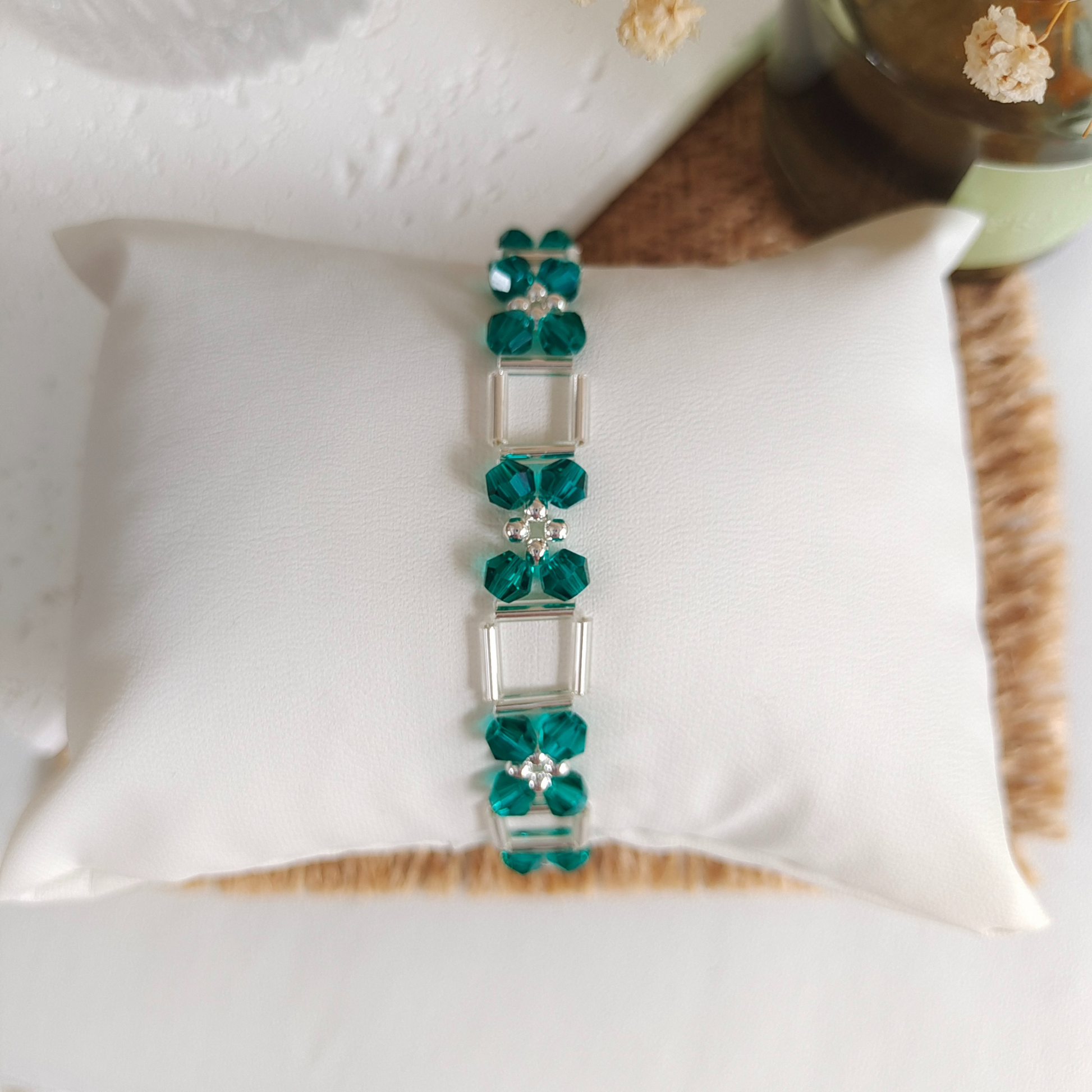 Beaded bracelet with peacock green crystals and silver accents