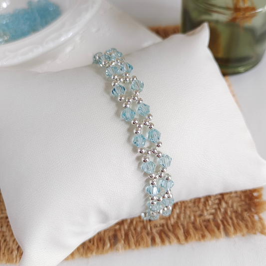 Handmade bracelet with lake blue crystals and silver beads