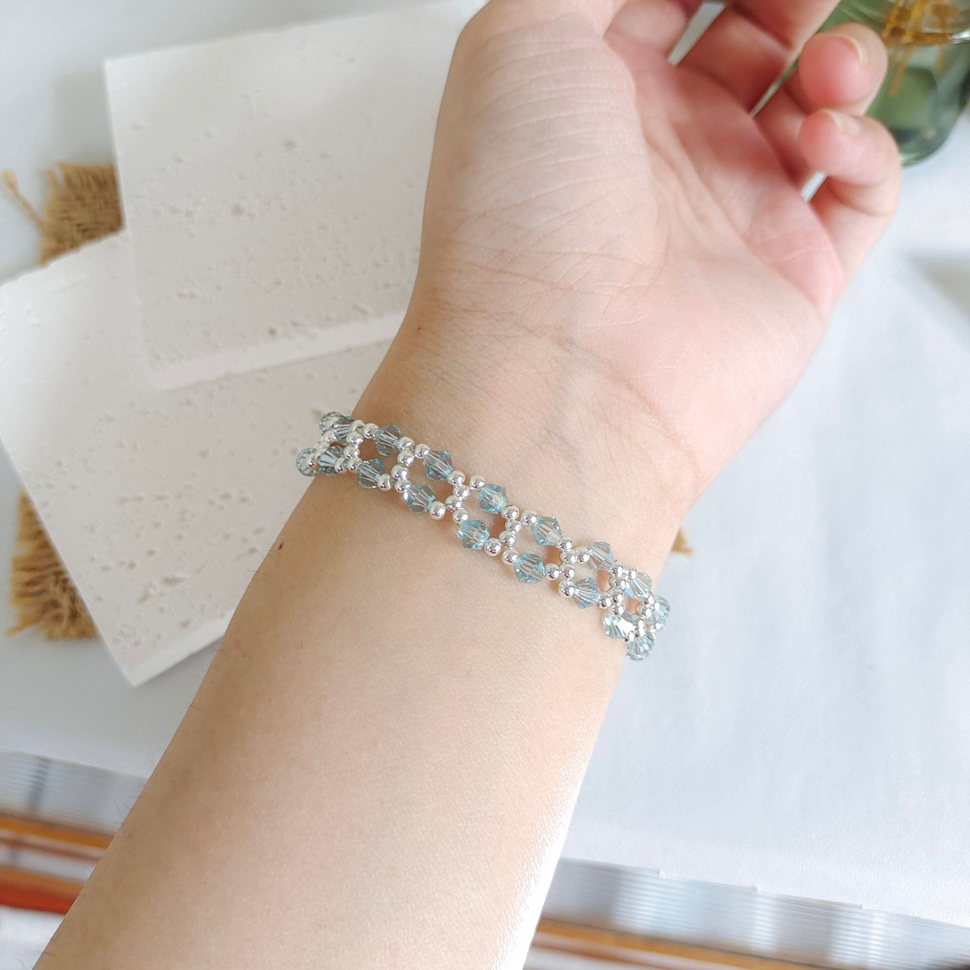 Ice lake blue crystal bracelet with silver beads on wrist