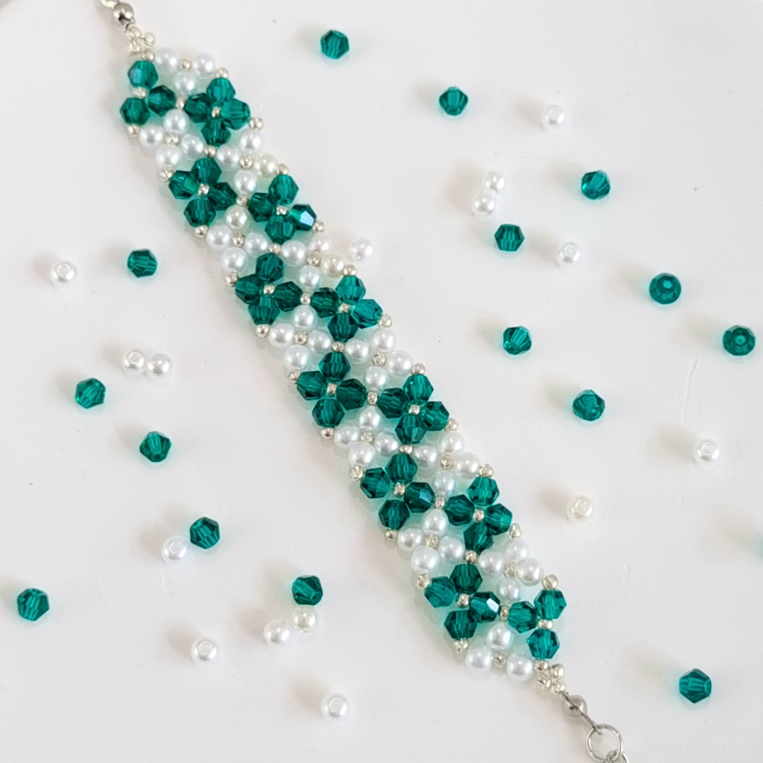 Handmade beaded bracelet in peacock green with elegant seed bead pattern