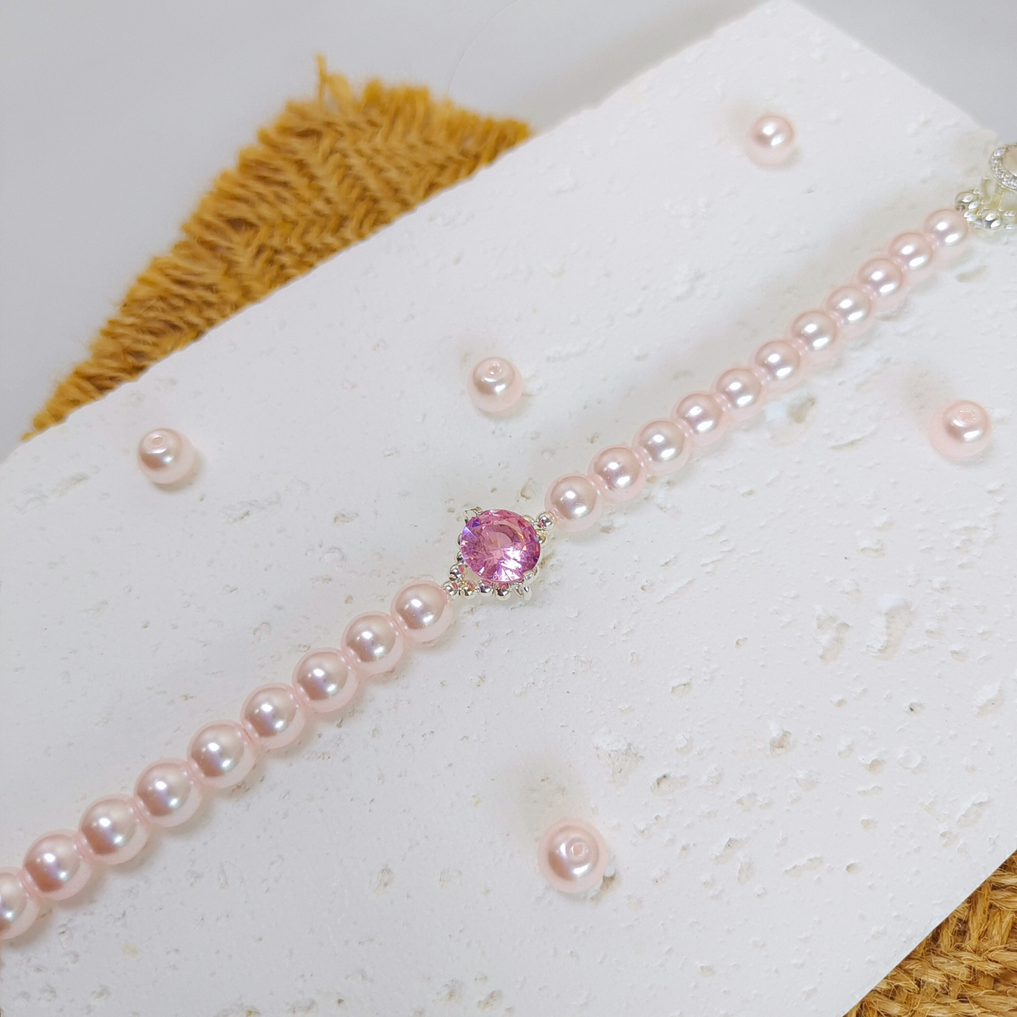 Close-up of pink pearls and sparkling pink rhinestone spacers