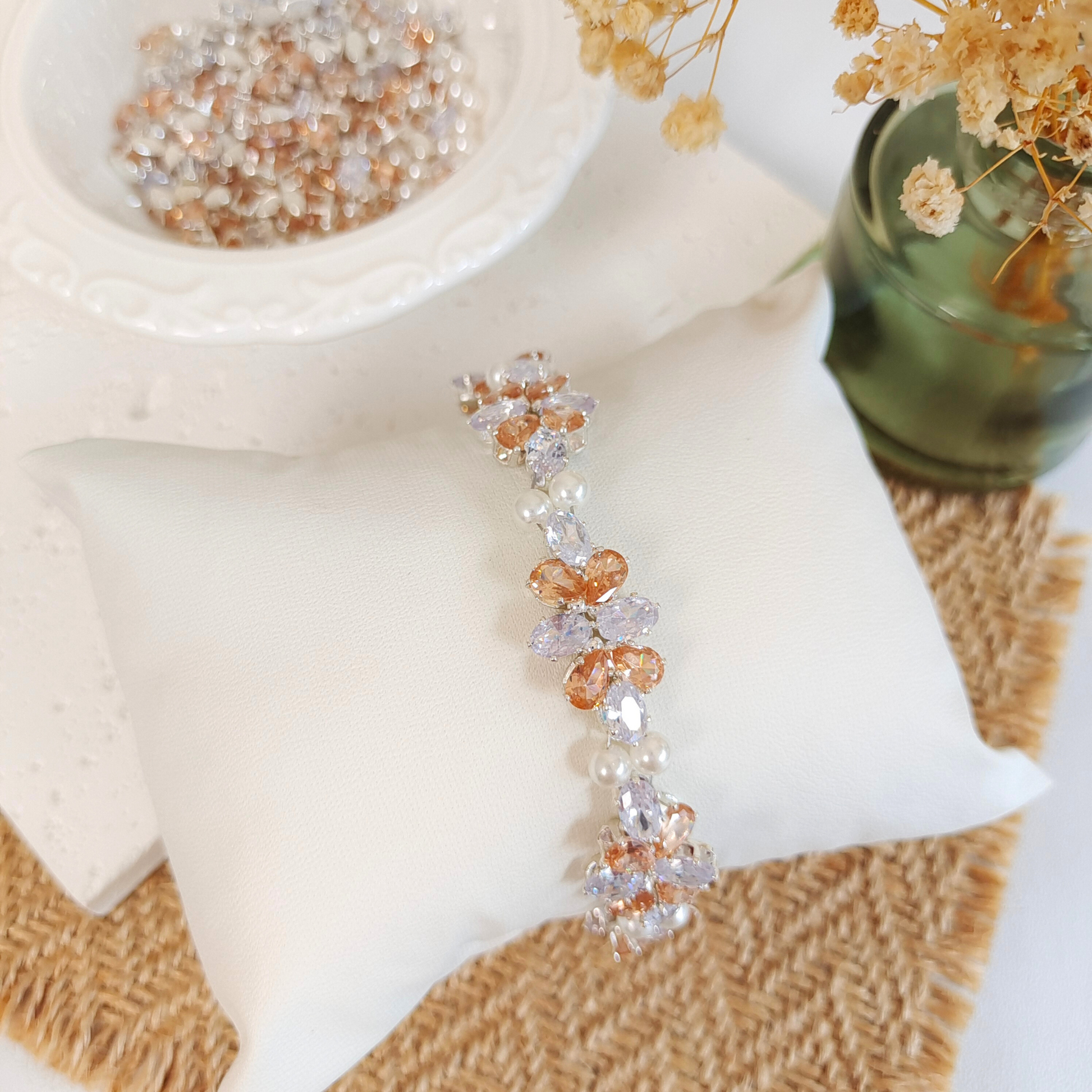 Handmade bracelet with white oval zircon, amber drop zircon, and pearls