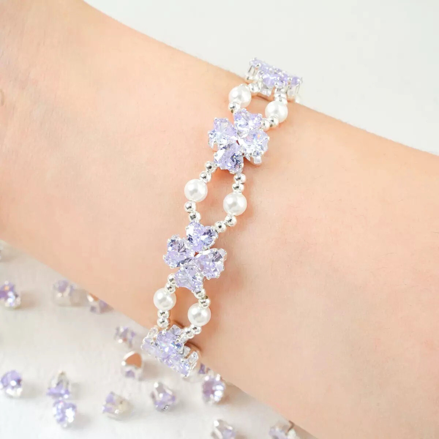 Worn view of purple heart zirconia bracelet