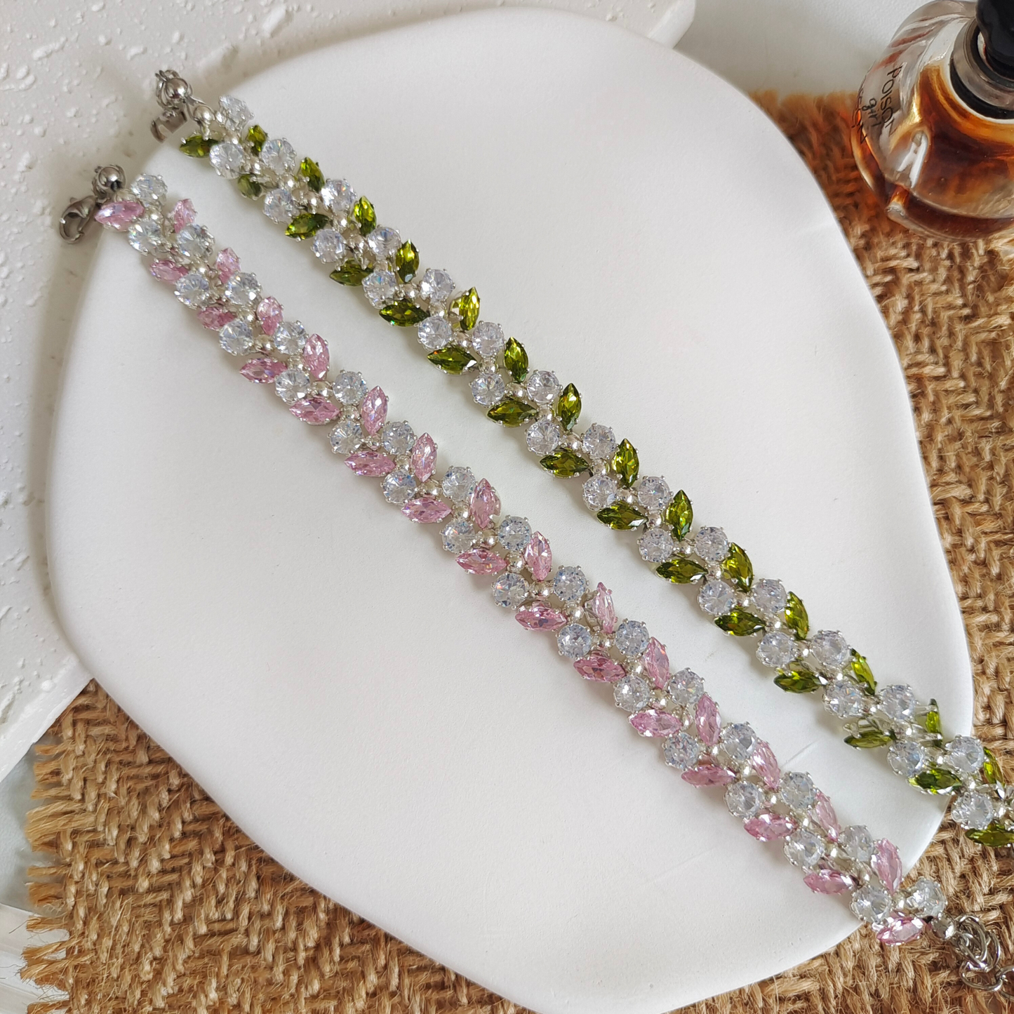 lat lay of handmade bracelet with olive branch zircon charm