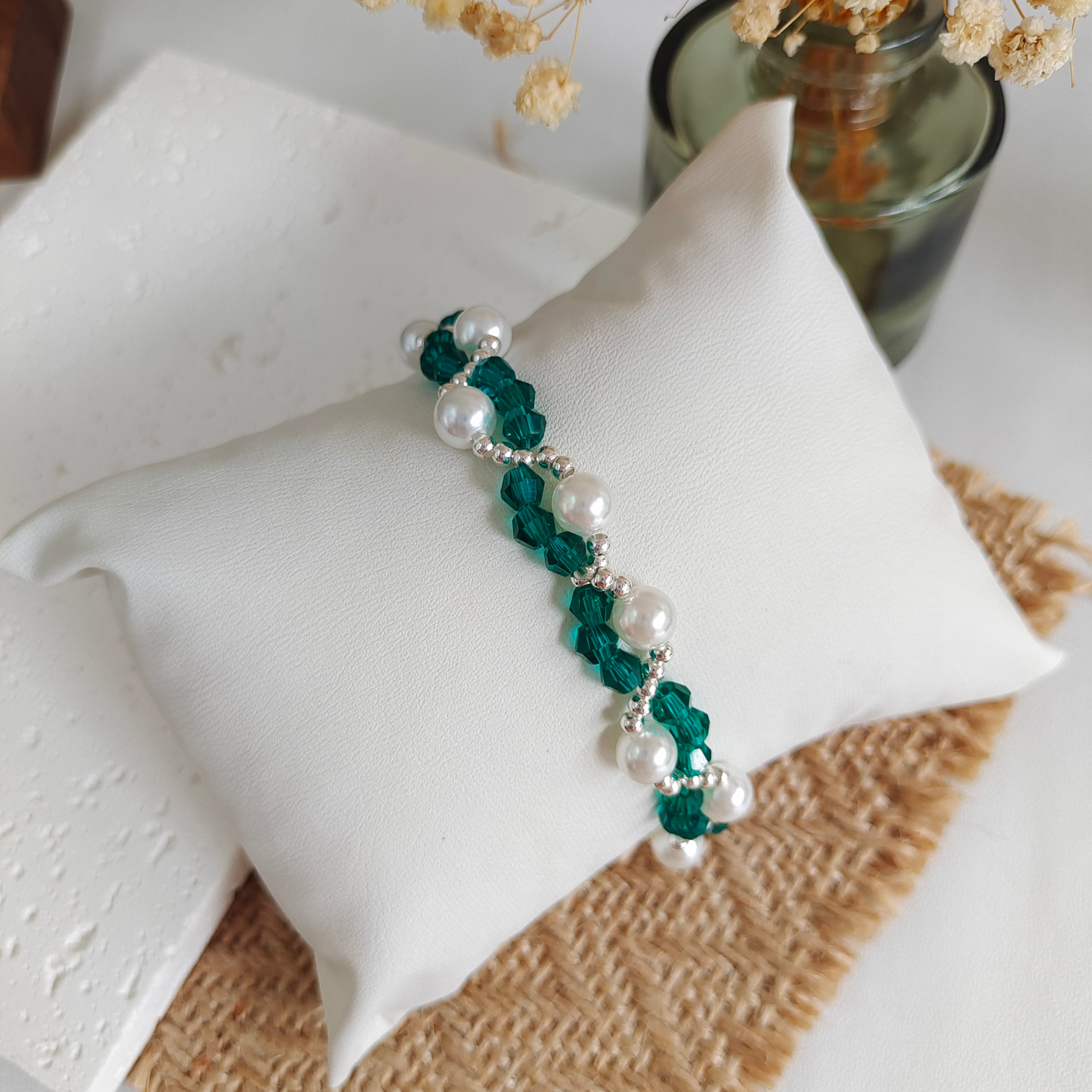 Handmade bracelet featuring crystal diamond-cut beads and oversized pearls