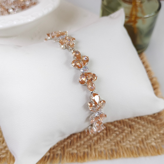 Zoomed detail showing prong-set amber and white zircon accents