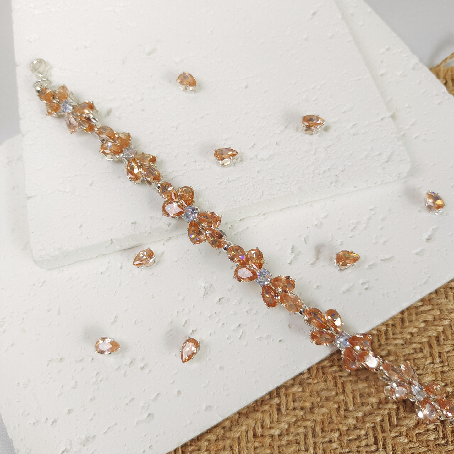 Sparkling detail of amber drop zircon paired with bright white stones