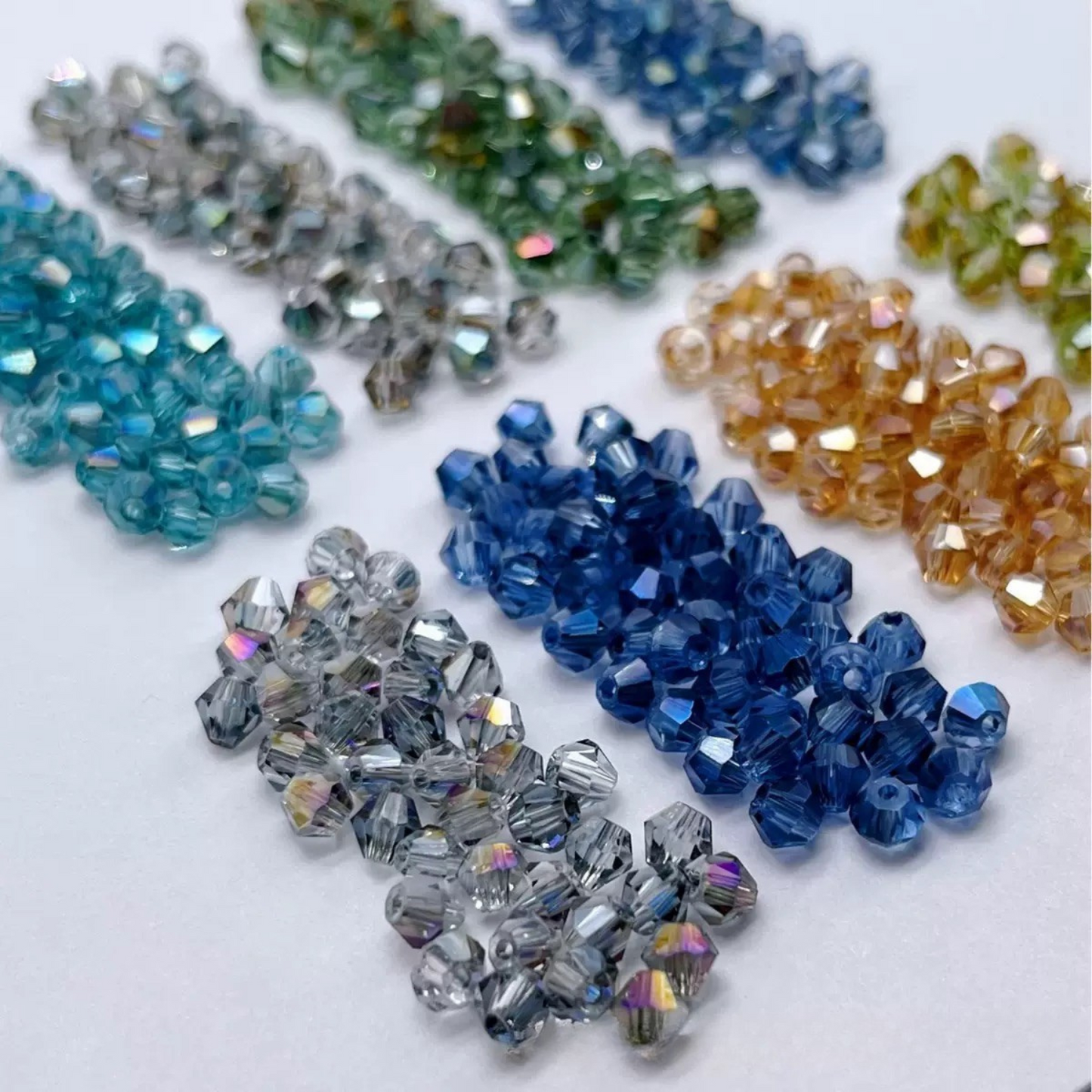 Iridescent AB finish diamond bead showing fine faceted detail