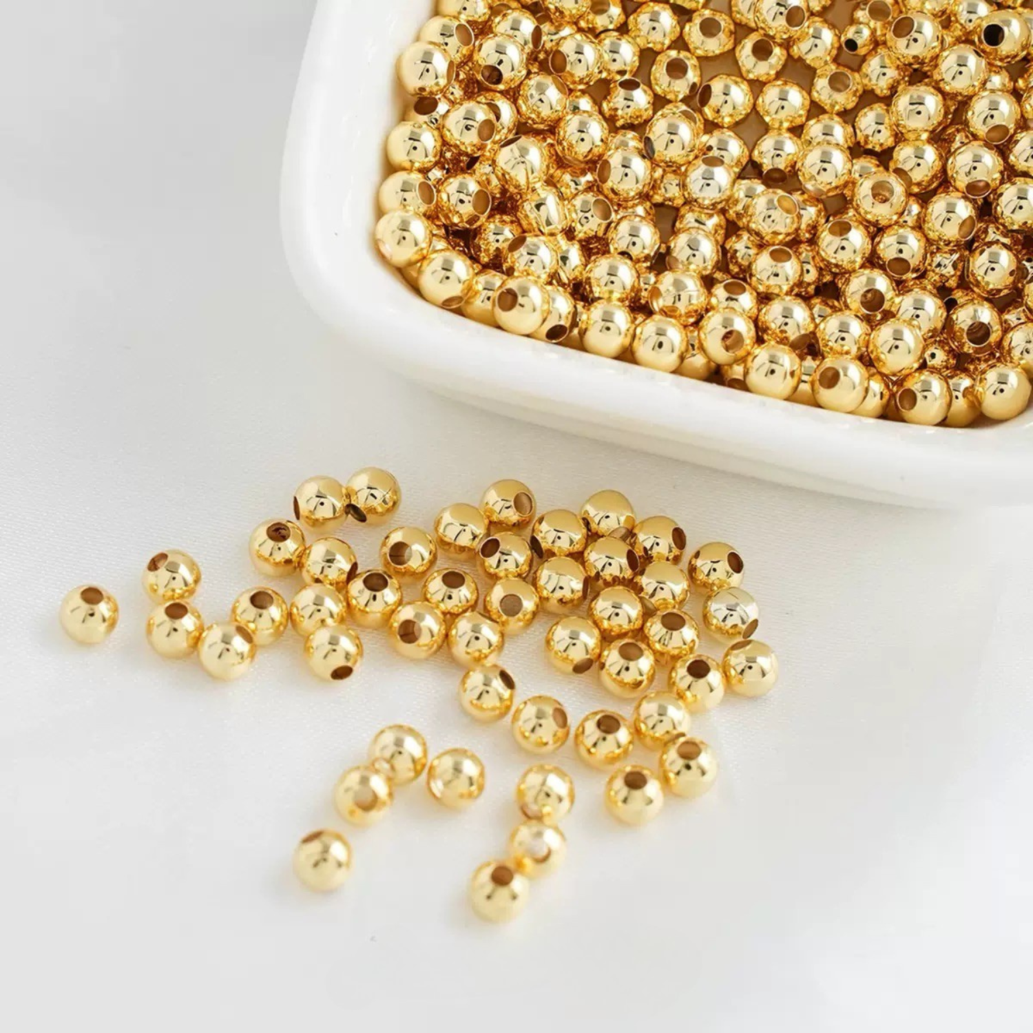 Gold seed beads for jewelry making and bead weaving projects