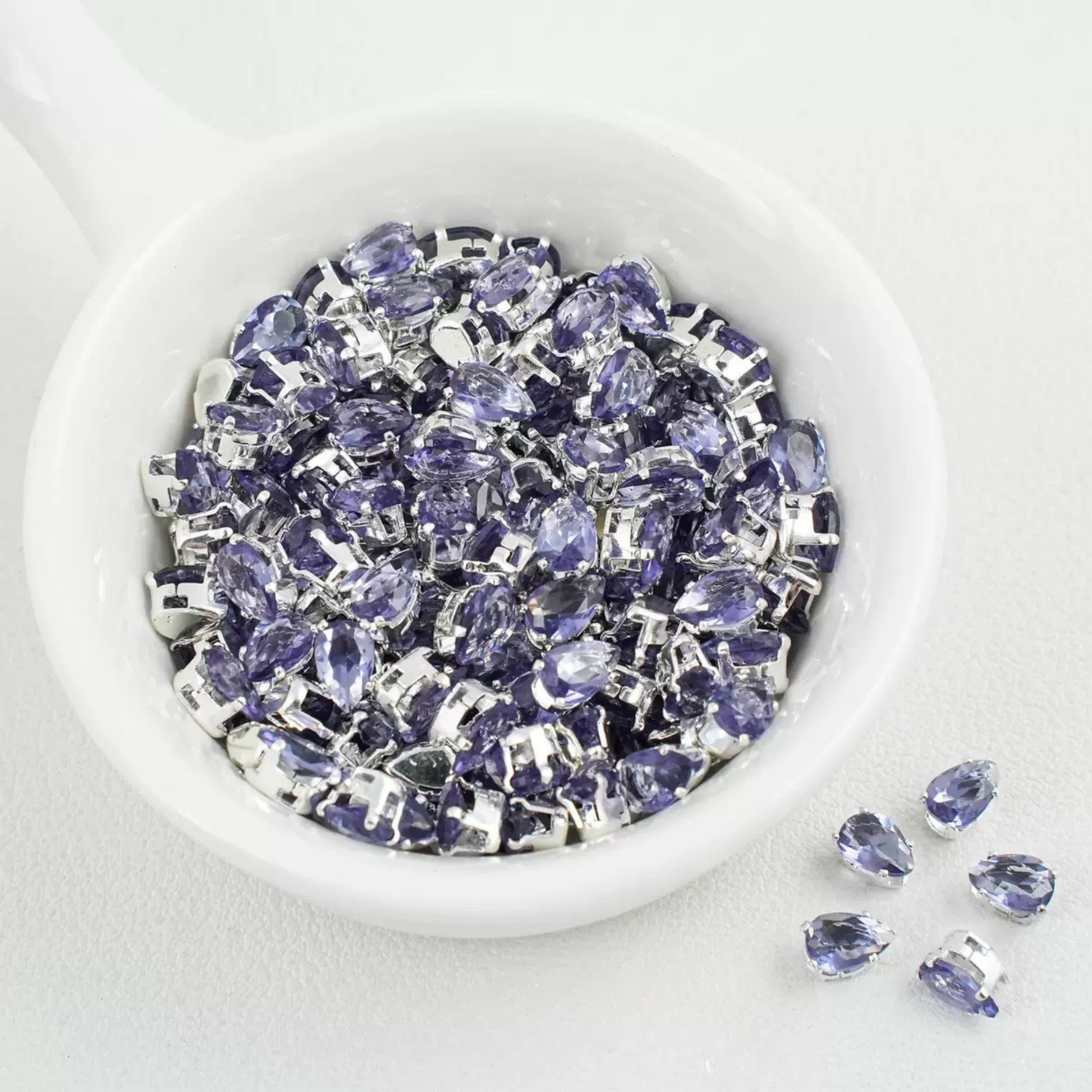 Dark purple teardrop-shaped zircon spacer bead in silver finish
