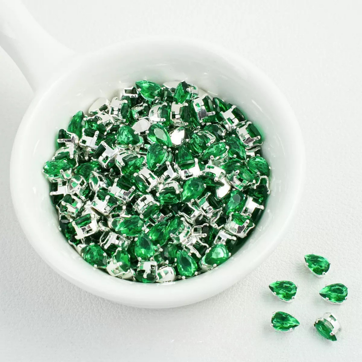 Forest green teardrop-shaped zircon spacer bead in silver finish