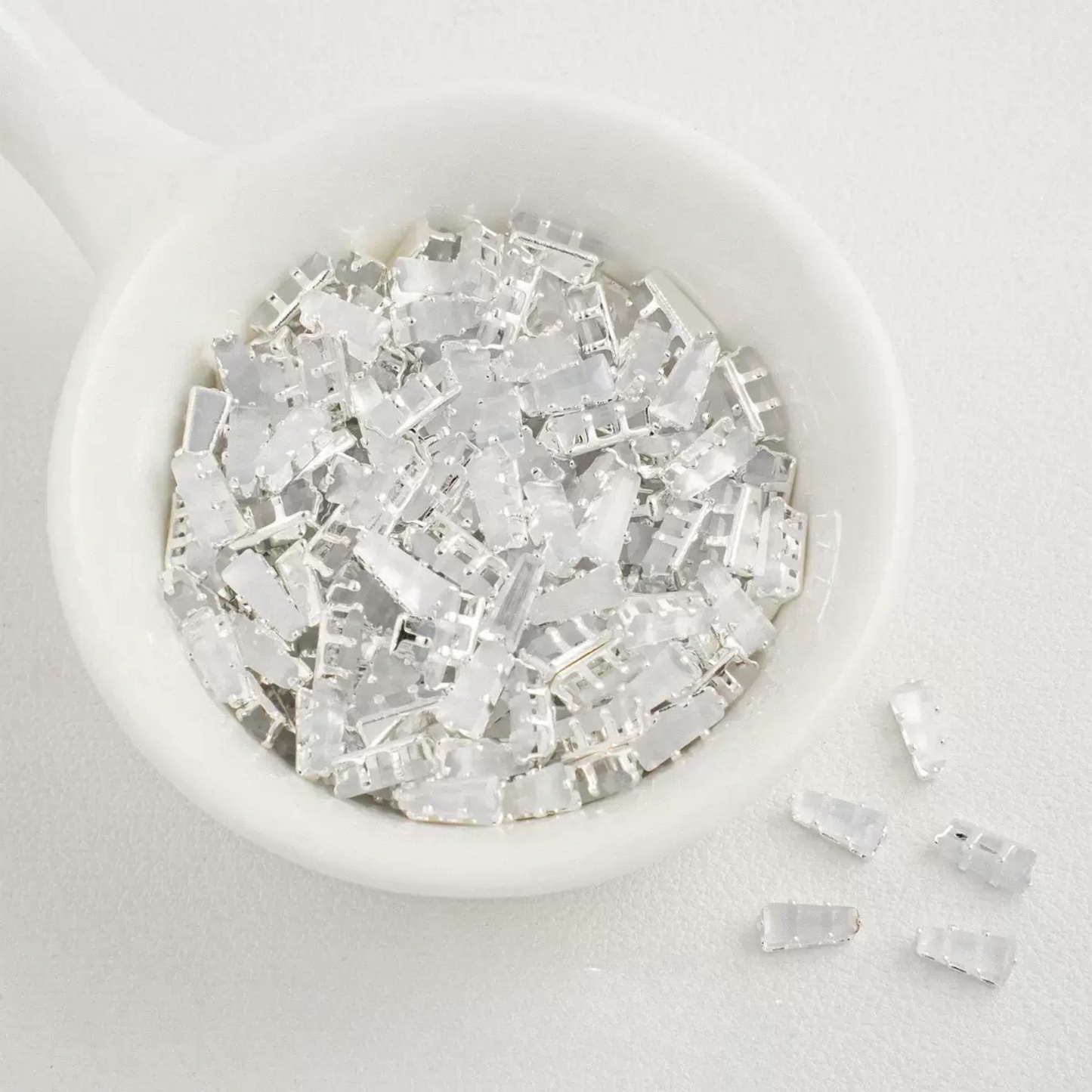 Cat eye white trapezoid-shaped zircon spacer with silver backing
