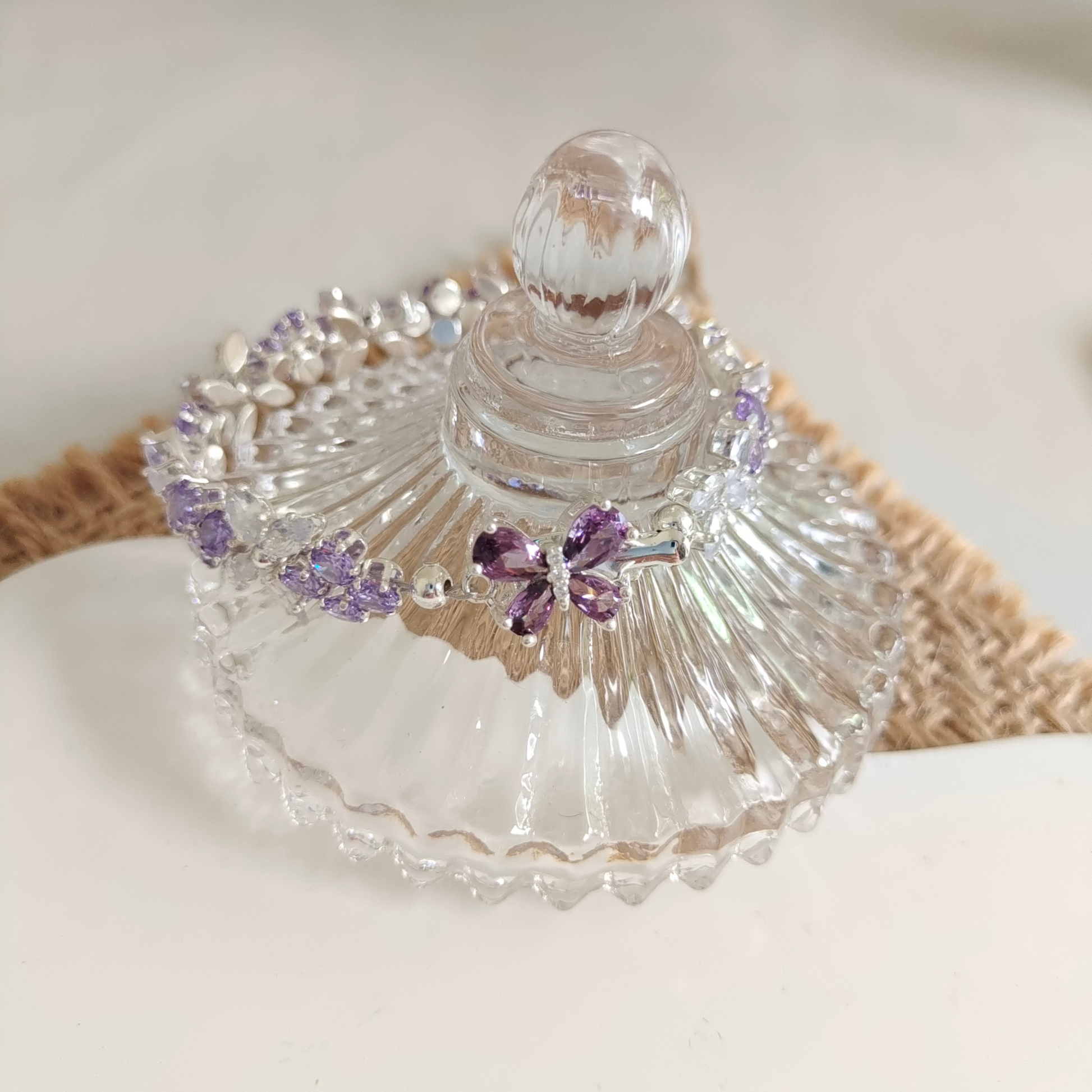 Zoomed-in image showing sparkling craftsmanship of the butterfly-shaped bracelet.
